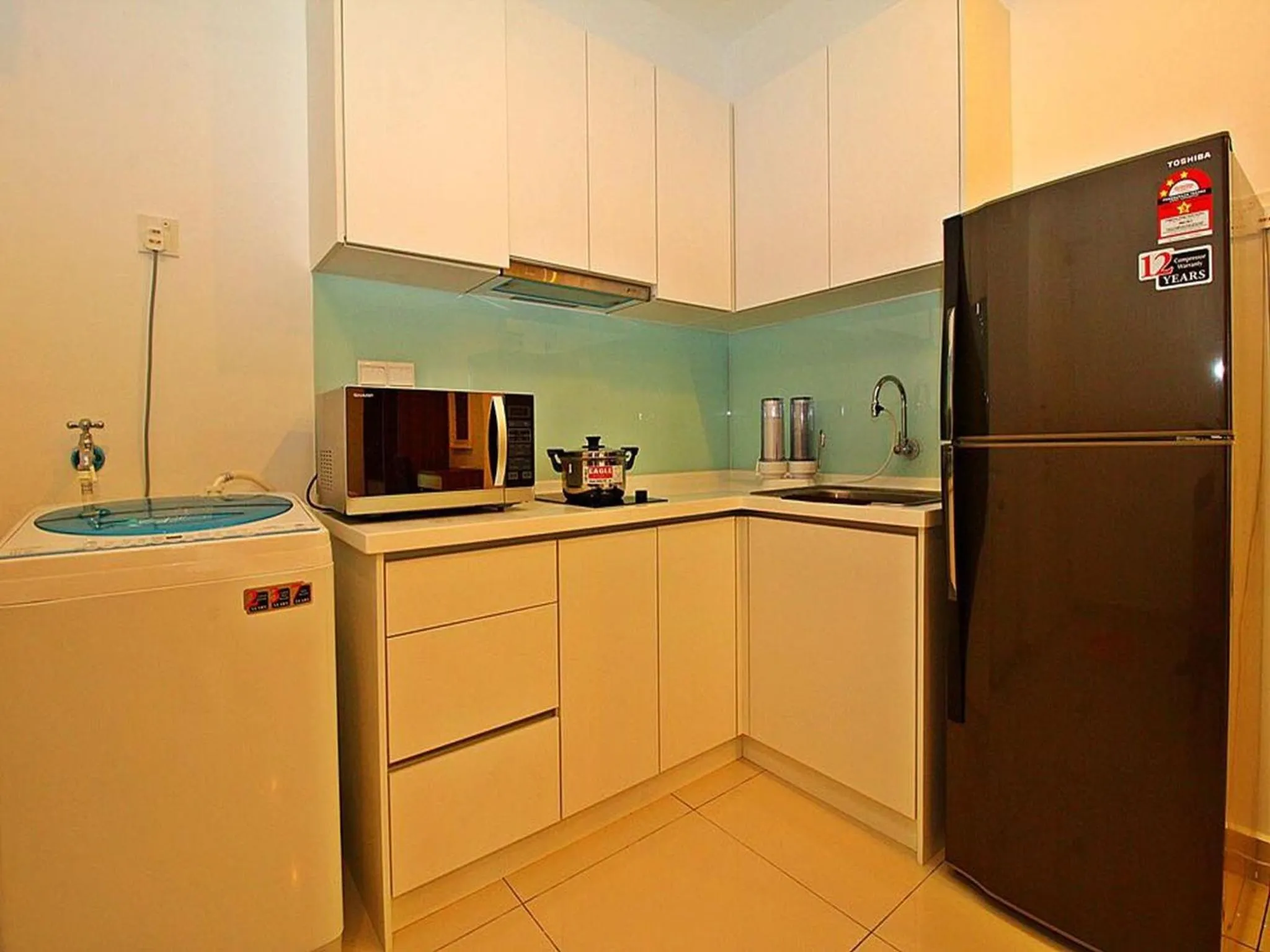 Kitchen or kitchenette in Merlene Suites at Mansion One Formerly know as Mansion One Suites