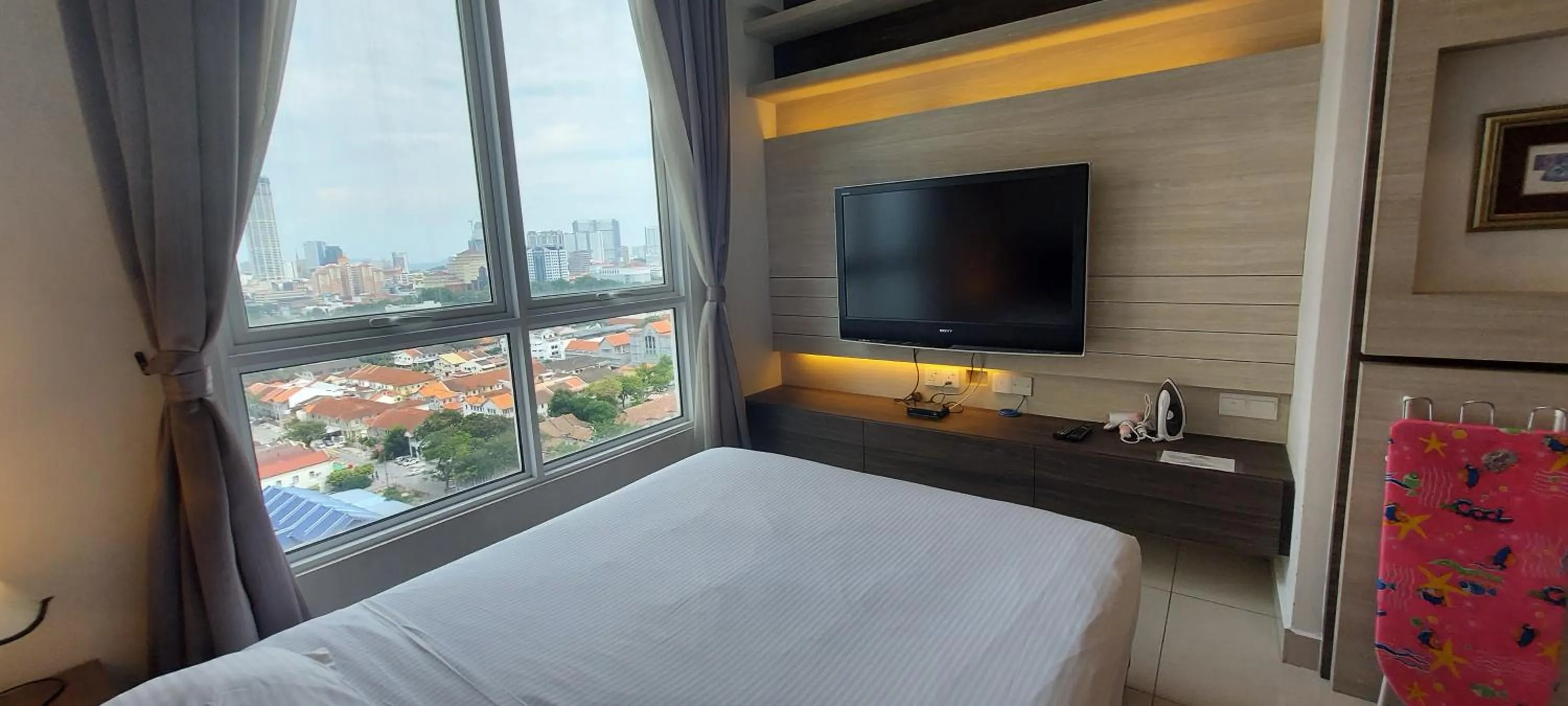 Living room, Bed in Merlene Suites at Mansion One Formerly know as Mansion One Suites