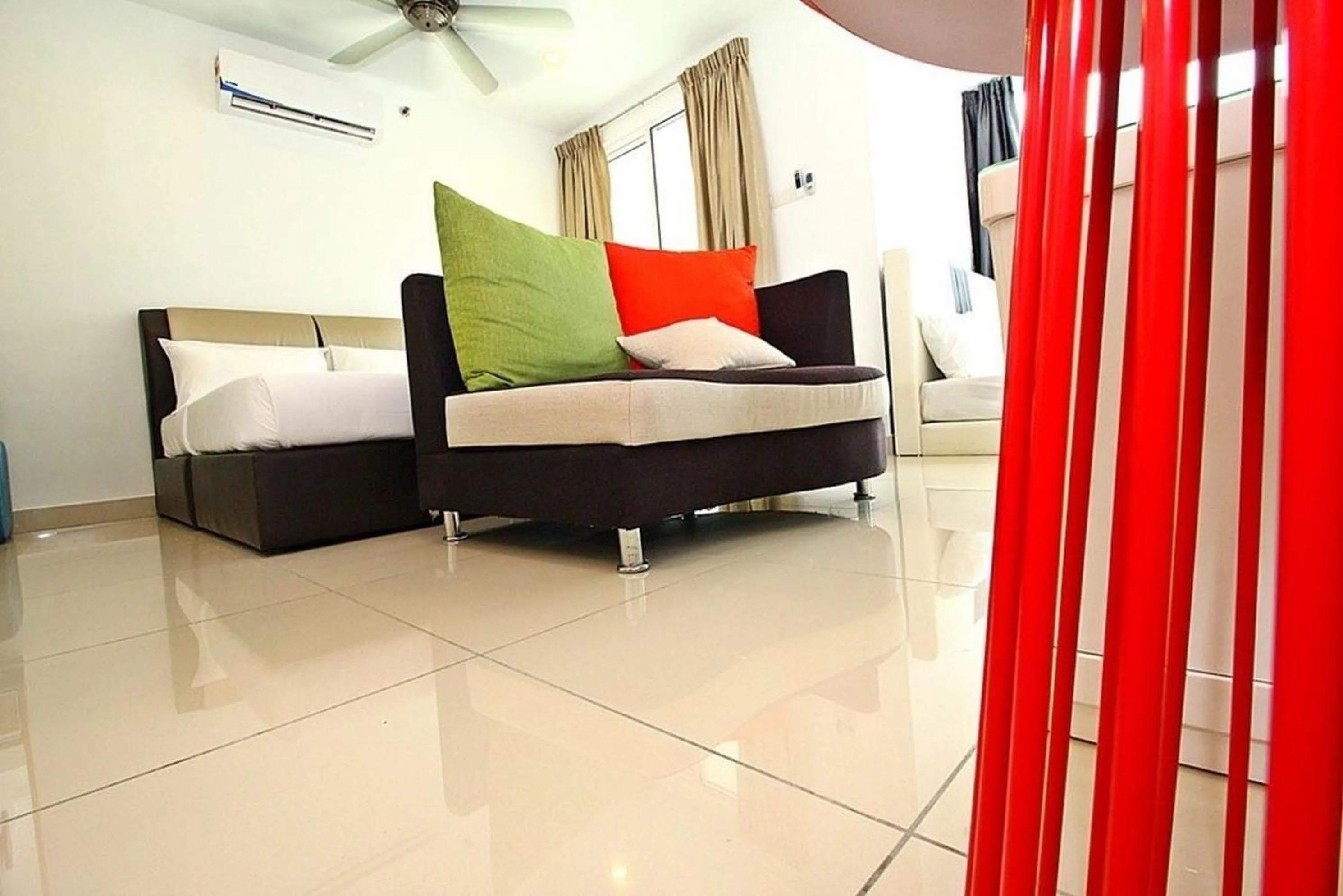 Living room, Bed in Merlene Suites at Mansion One Formerly know as Mansion One Suites