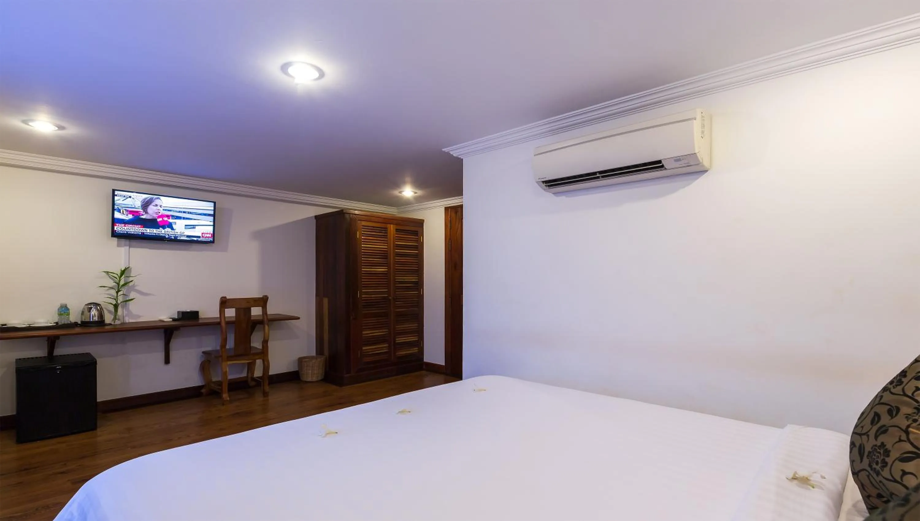 Bed, TV/Entertainment Center in Angkor Ry Boutique
