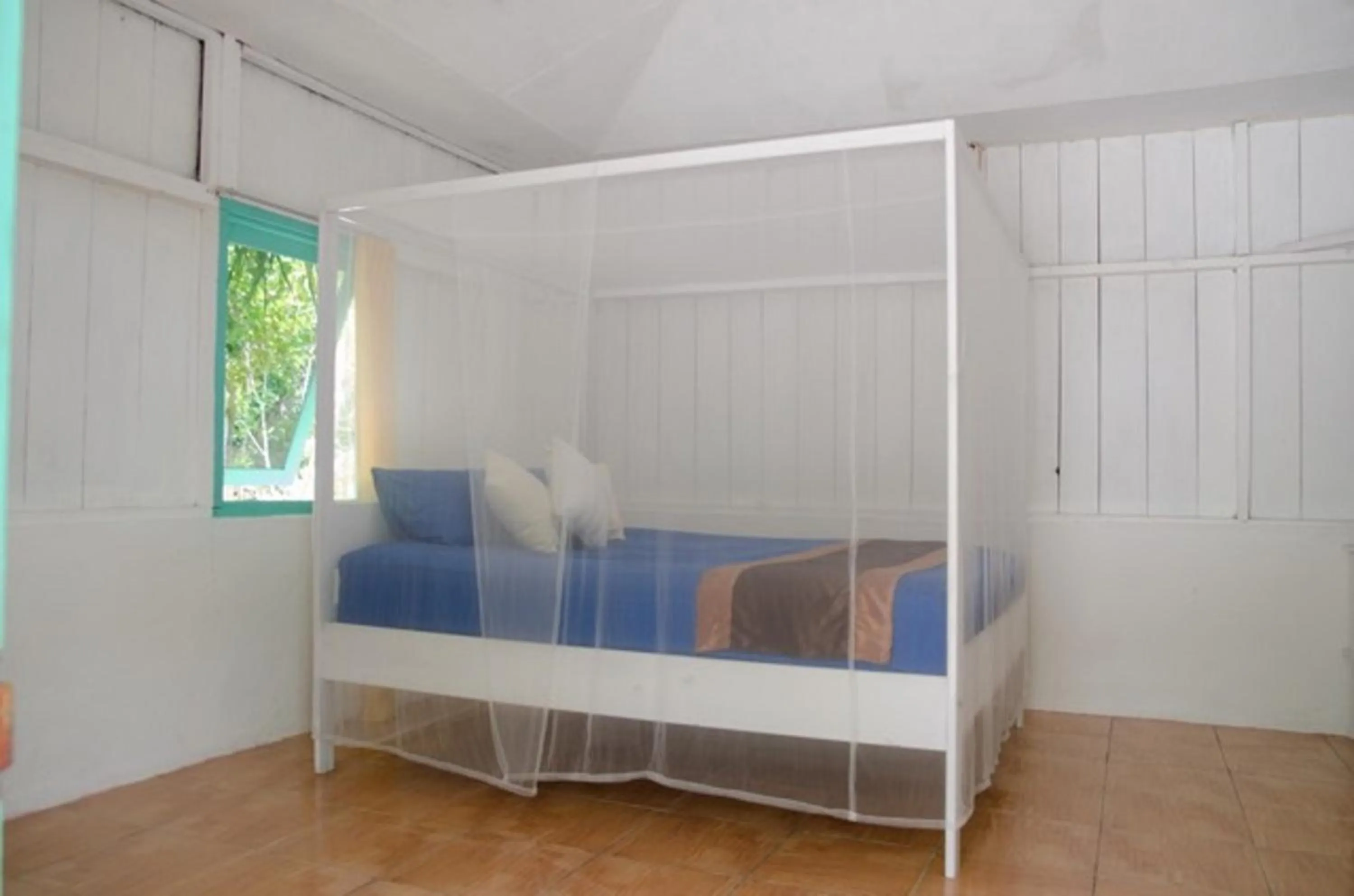 Bed in Scuba Republic Beach Bungalows