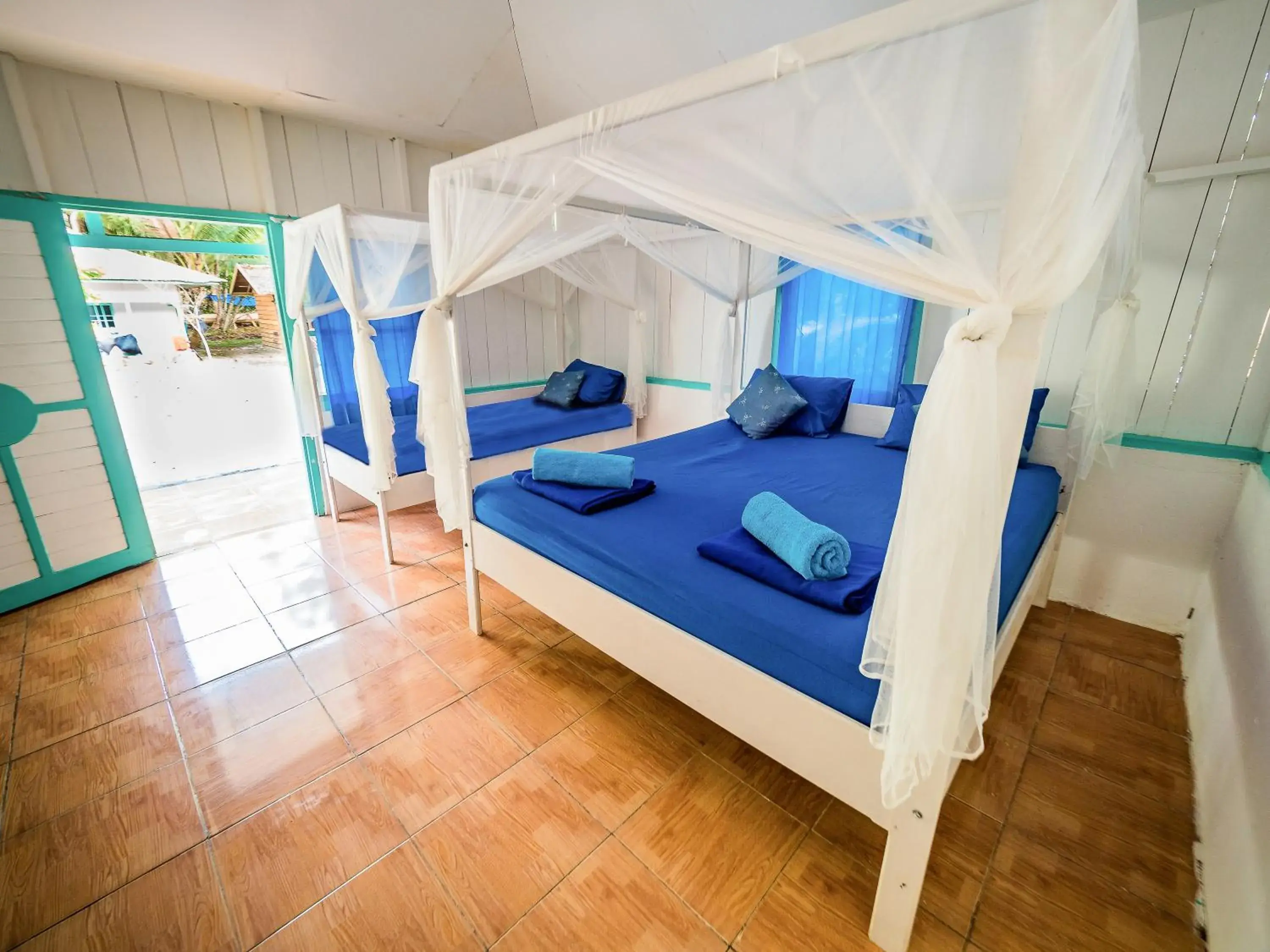Double and Single Bed in Scuba Republic Beach Bungalows Double and Single Bed in Scuba Republic Beach Bungalows
