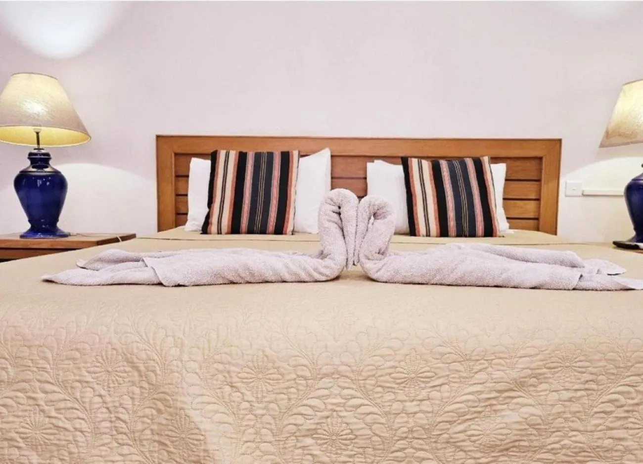 Bed in Ocean Villas Apart Hotel