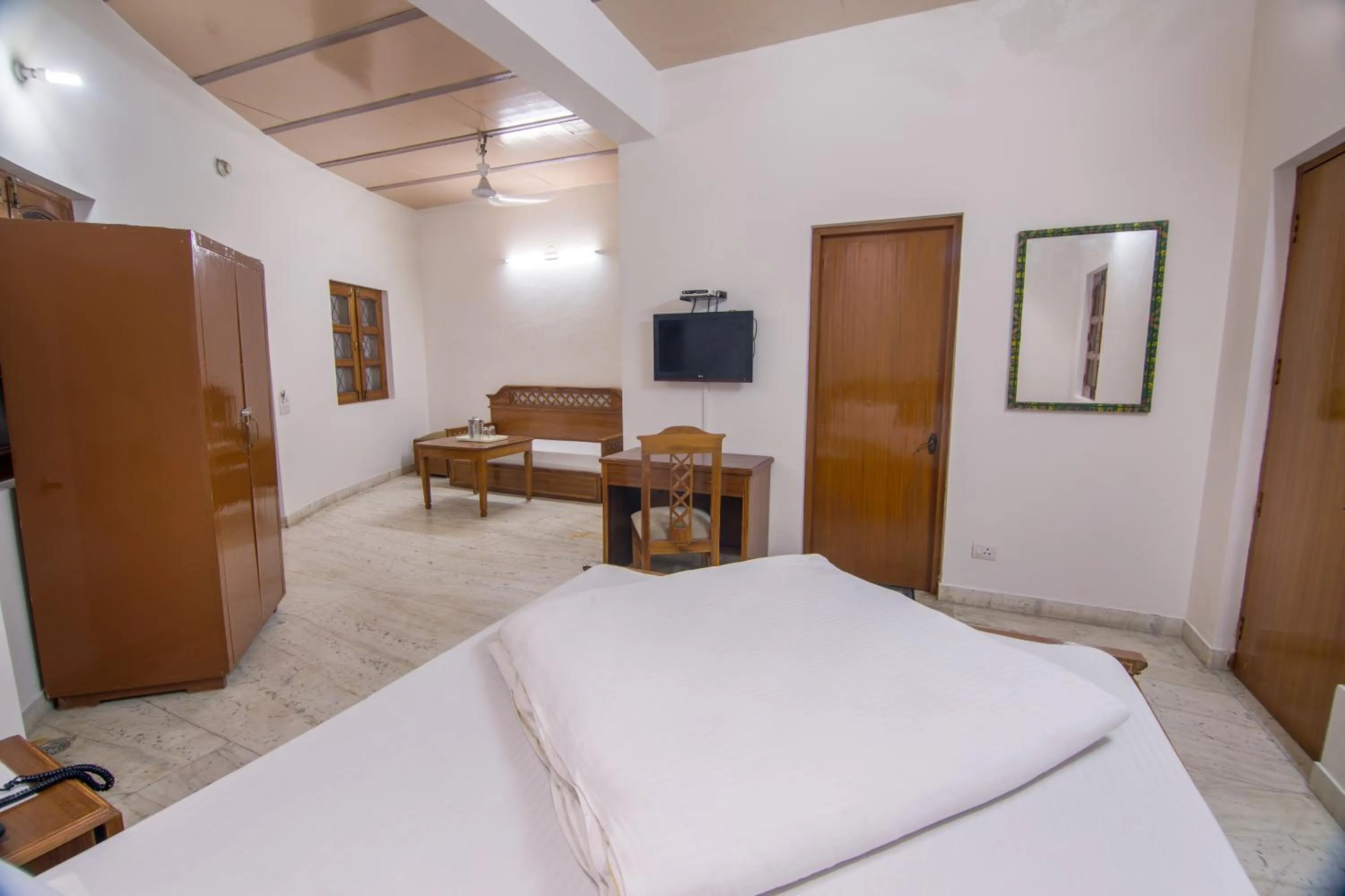 Bed in Hotel Bhakti Dhama