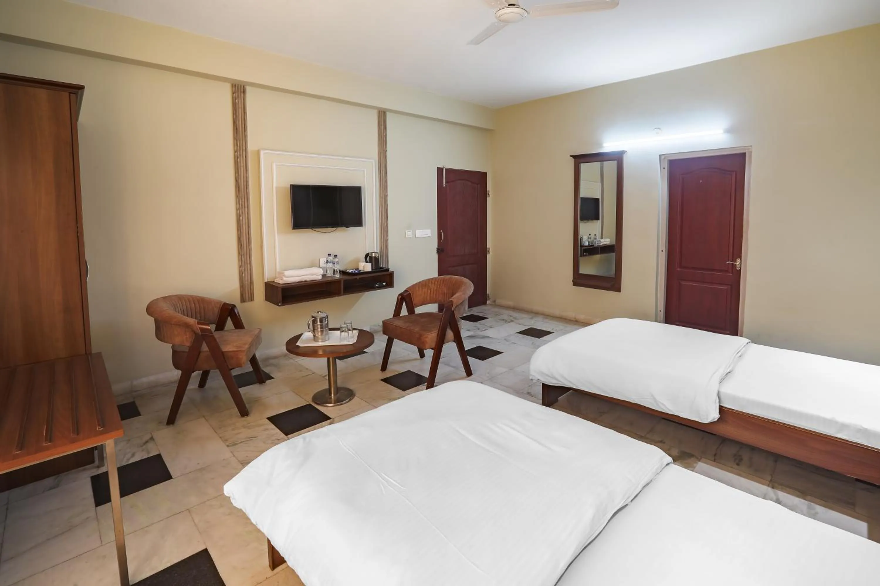 Bed in Hotel Bhakti Dhama