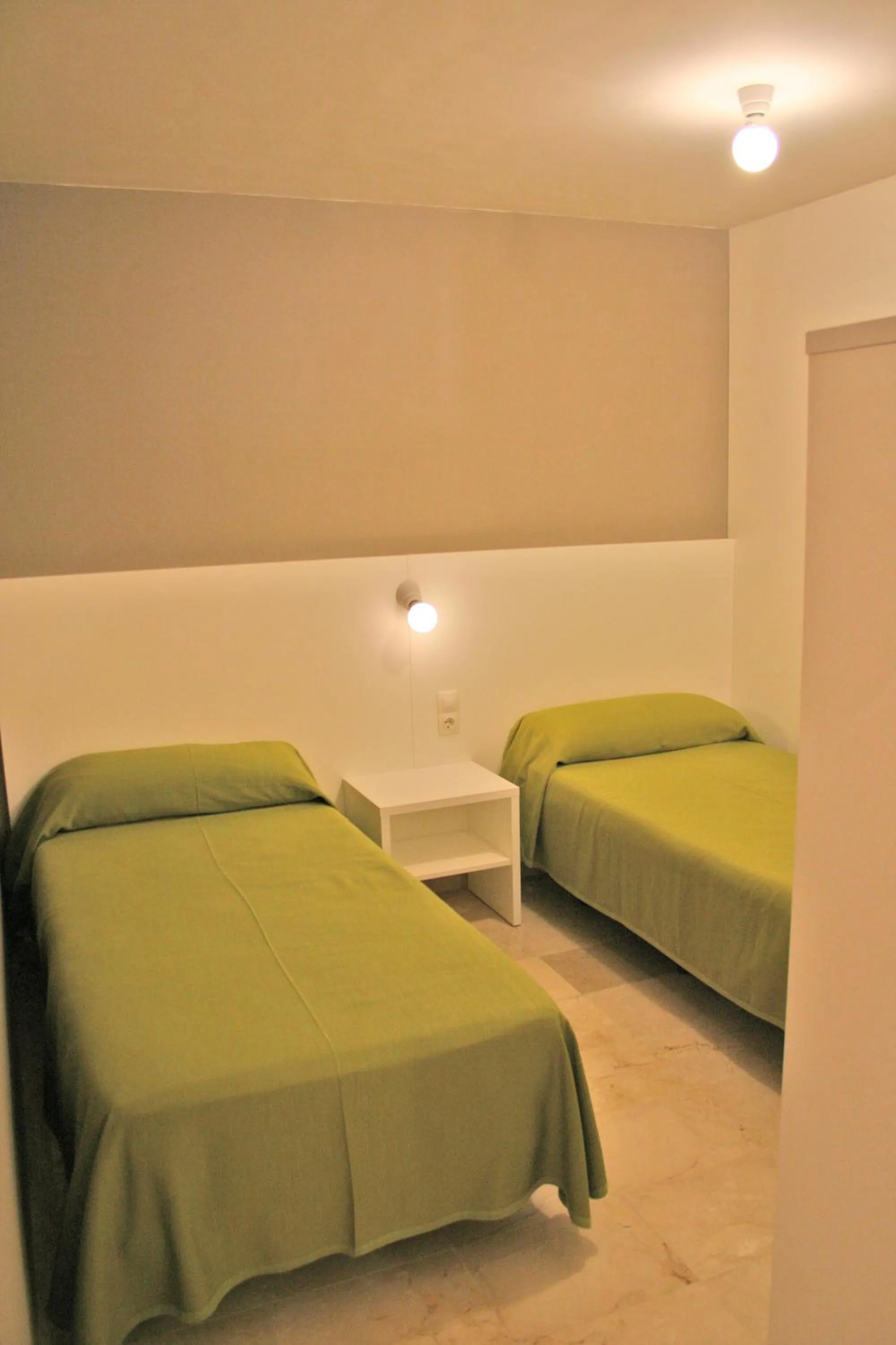 Bed in L' Escala Resort