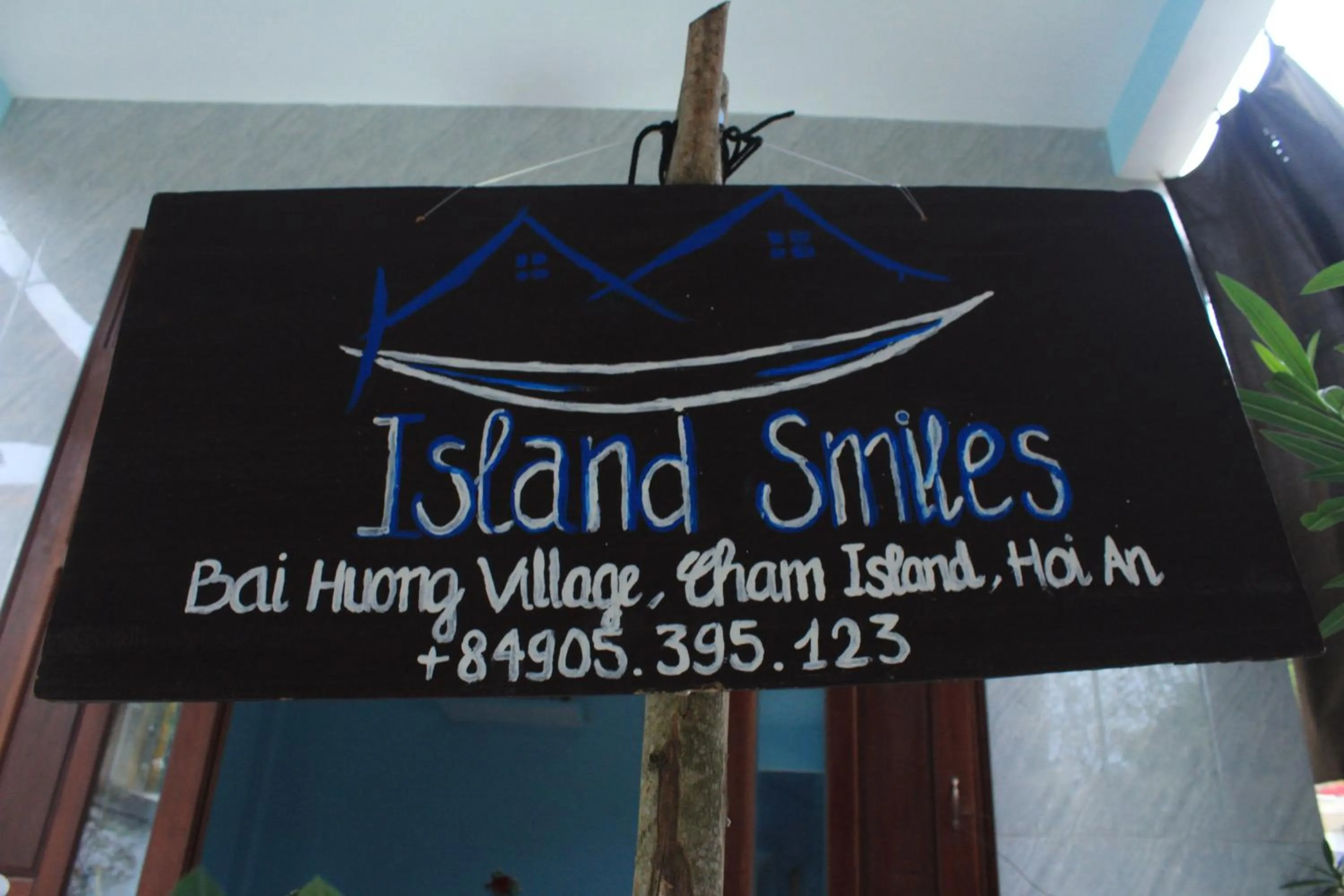 Property logo or sign in Cham Island Smiles Homestay