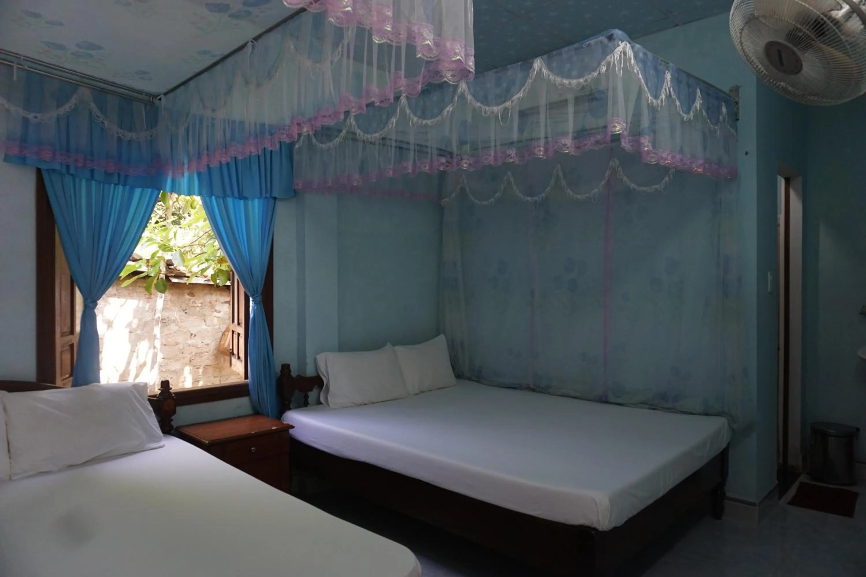 Bed in Cham Island Smiles Homestay
