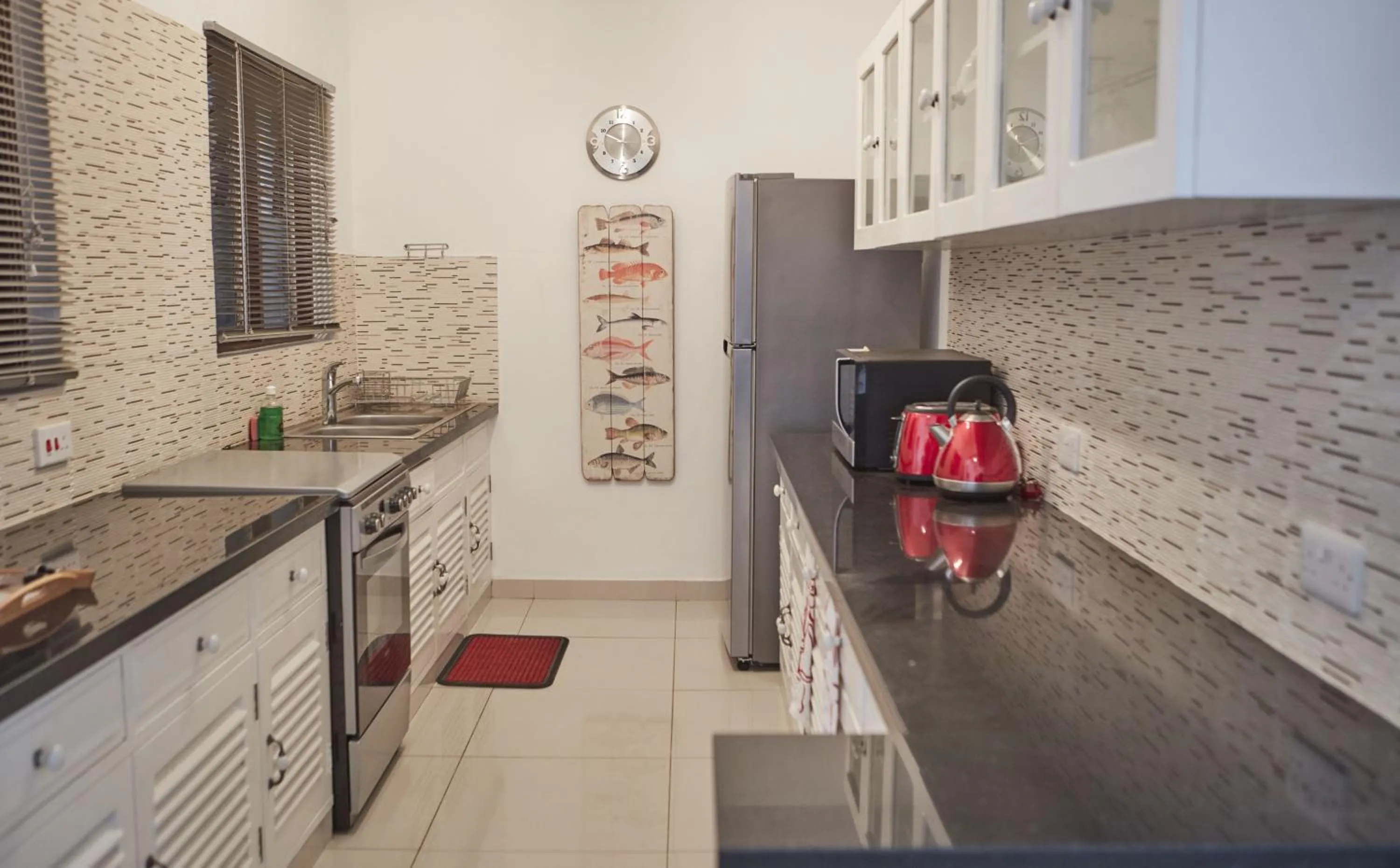 Kitchen or kitchenette in Tamarind Village Hotel Apartments