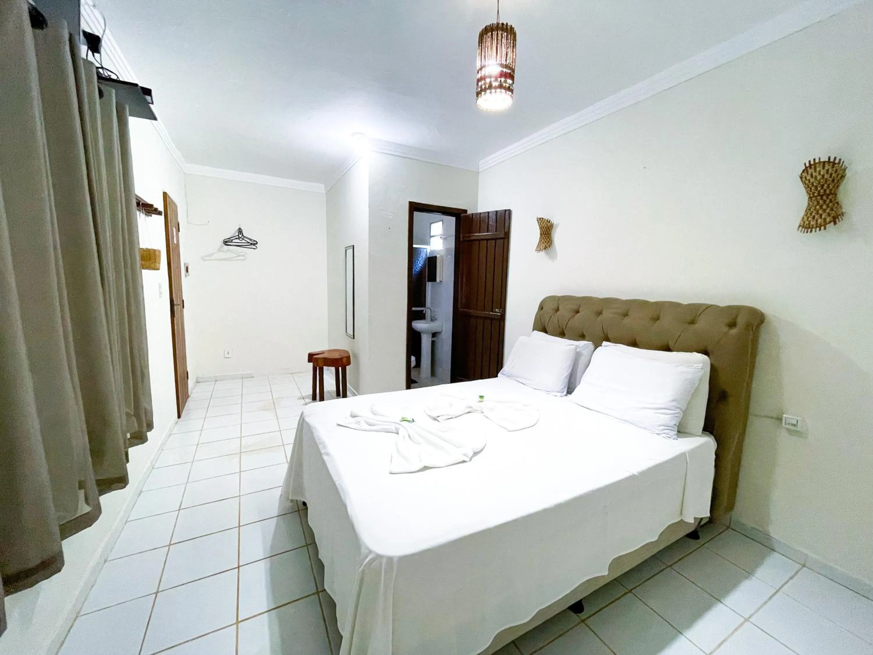 Bed in Pousada Vôo da Águia