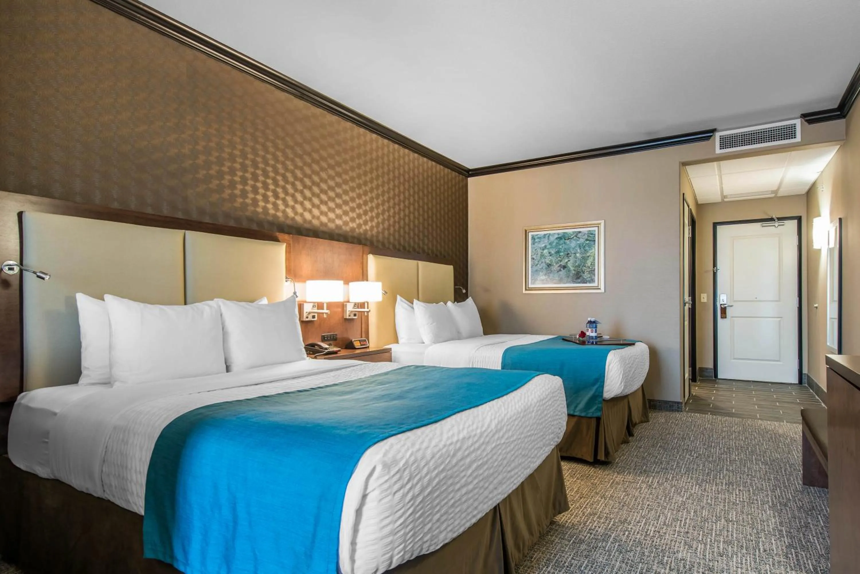 Bedroom, Room Photo in The Heritage Inn & Suites, Ascend Hotel Collection