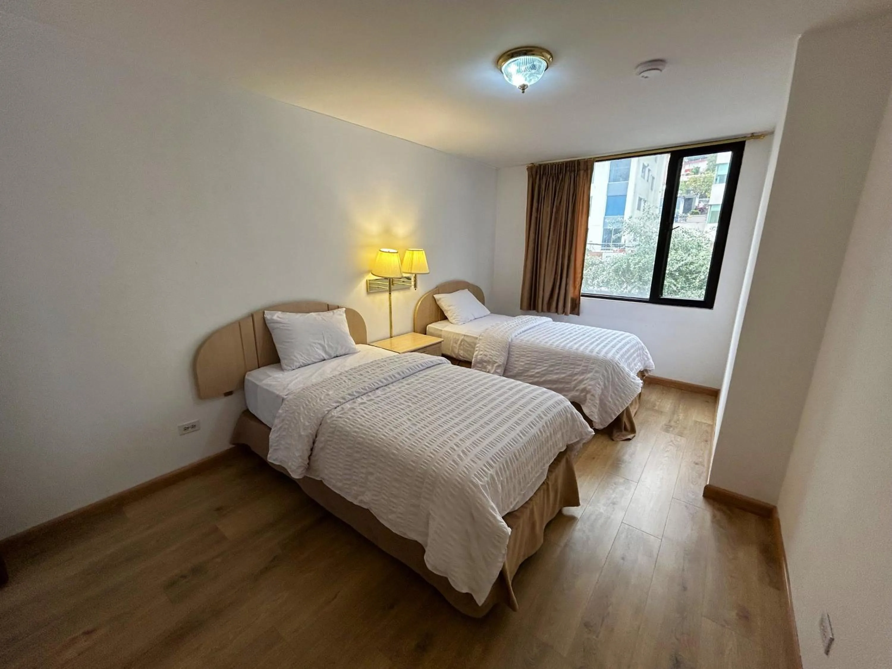 Bed in Stanford Suites Hotel