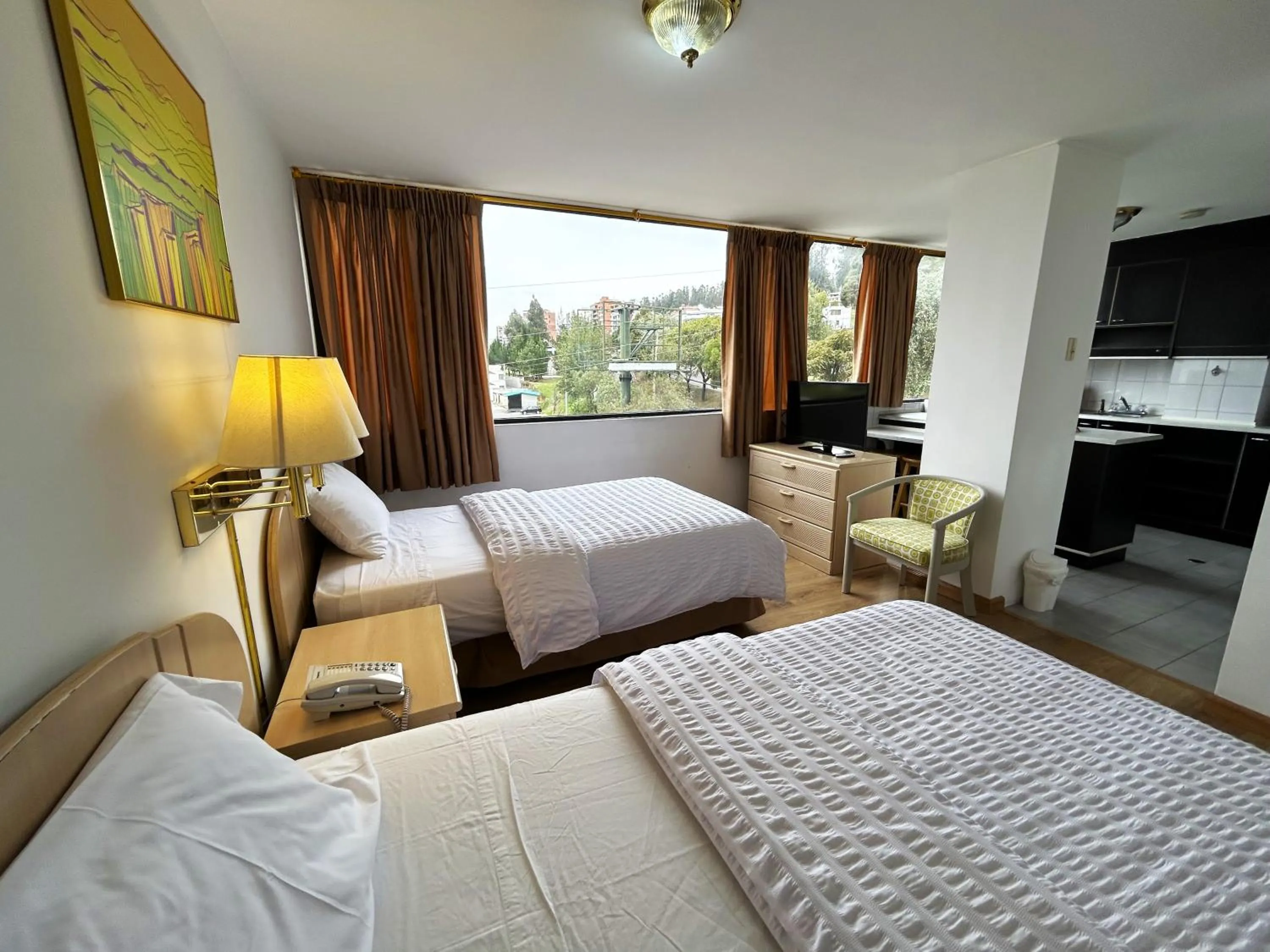 Bed in Stanford Suites Hotel