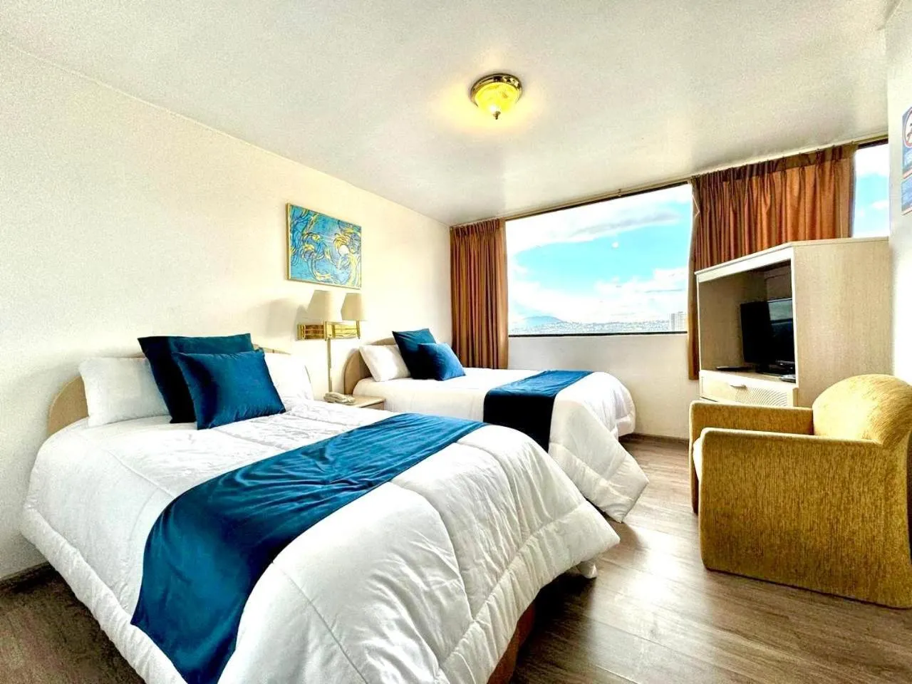 Bed in Stanford Suites Hotel