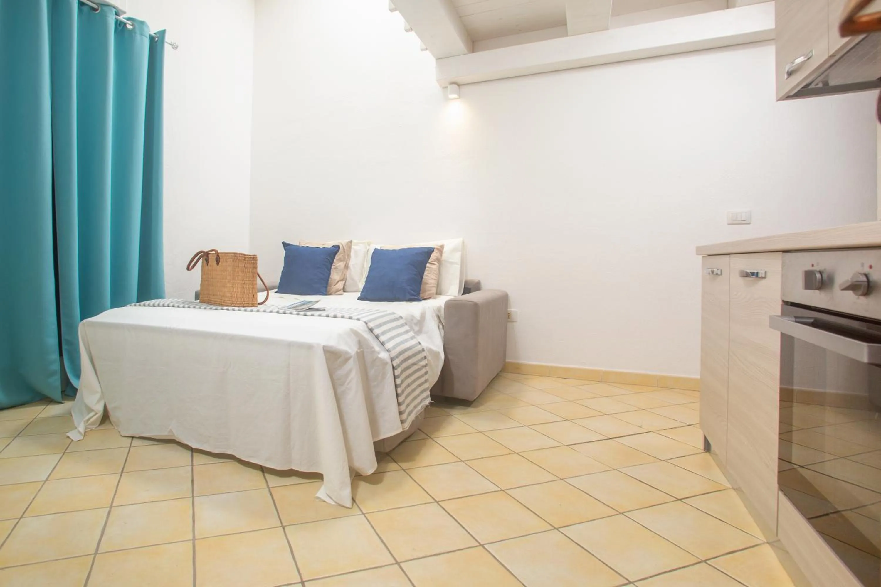 Living room, Bed in Appartamenti Residence Zodiaco