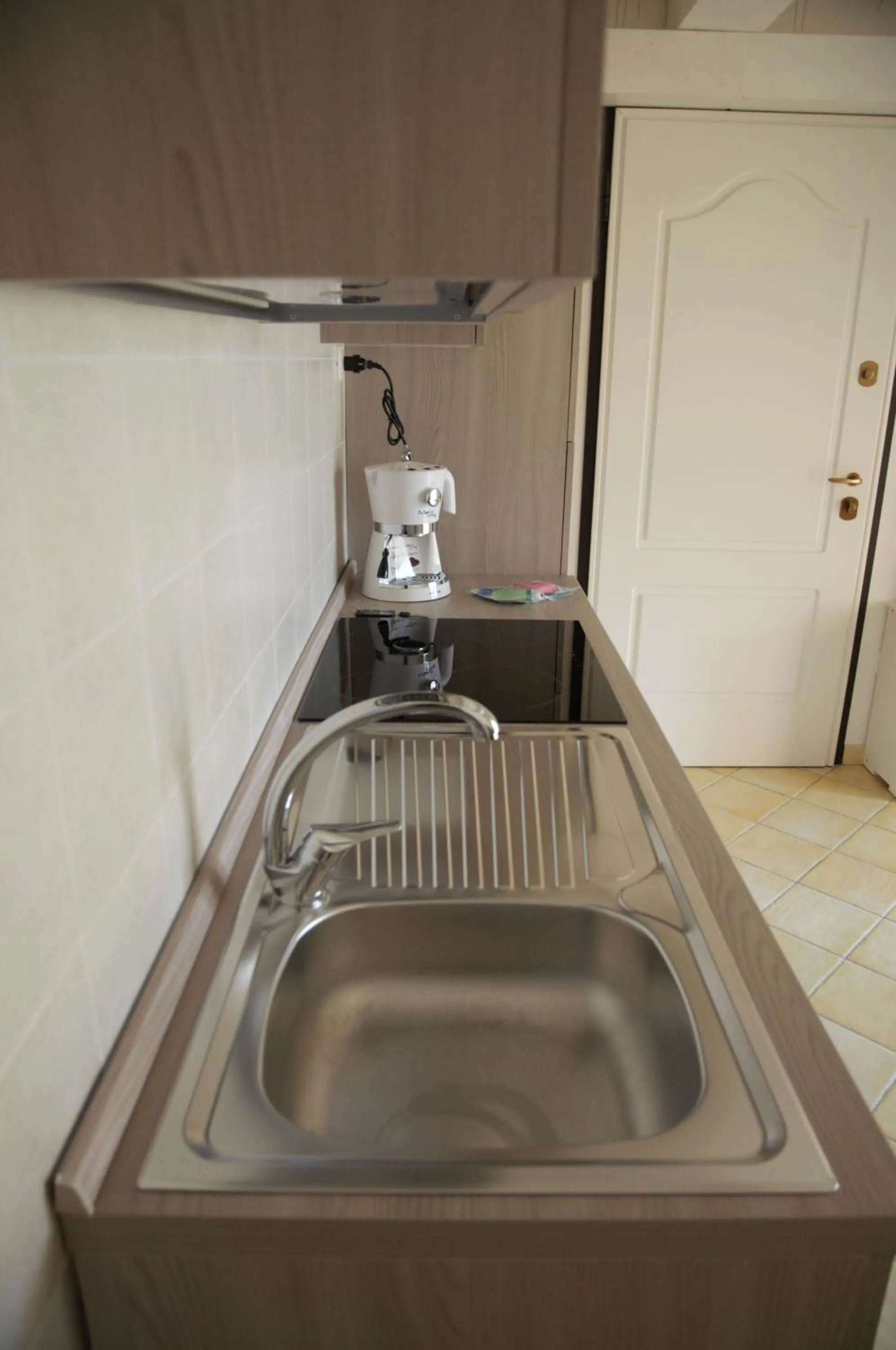 Kitchen or kitchenette in Appartamenti Residence Zodiaco