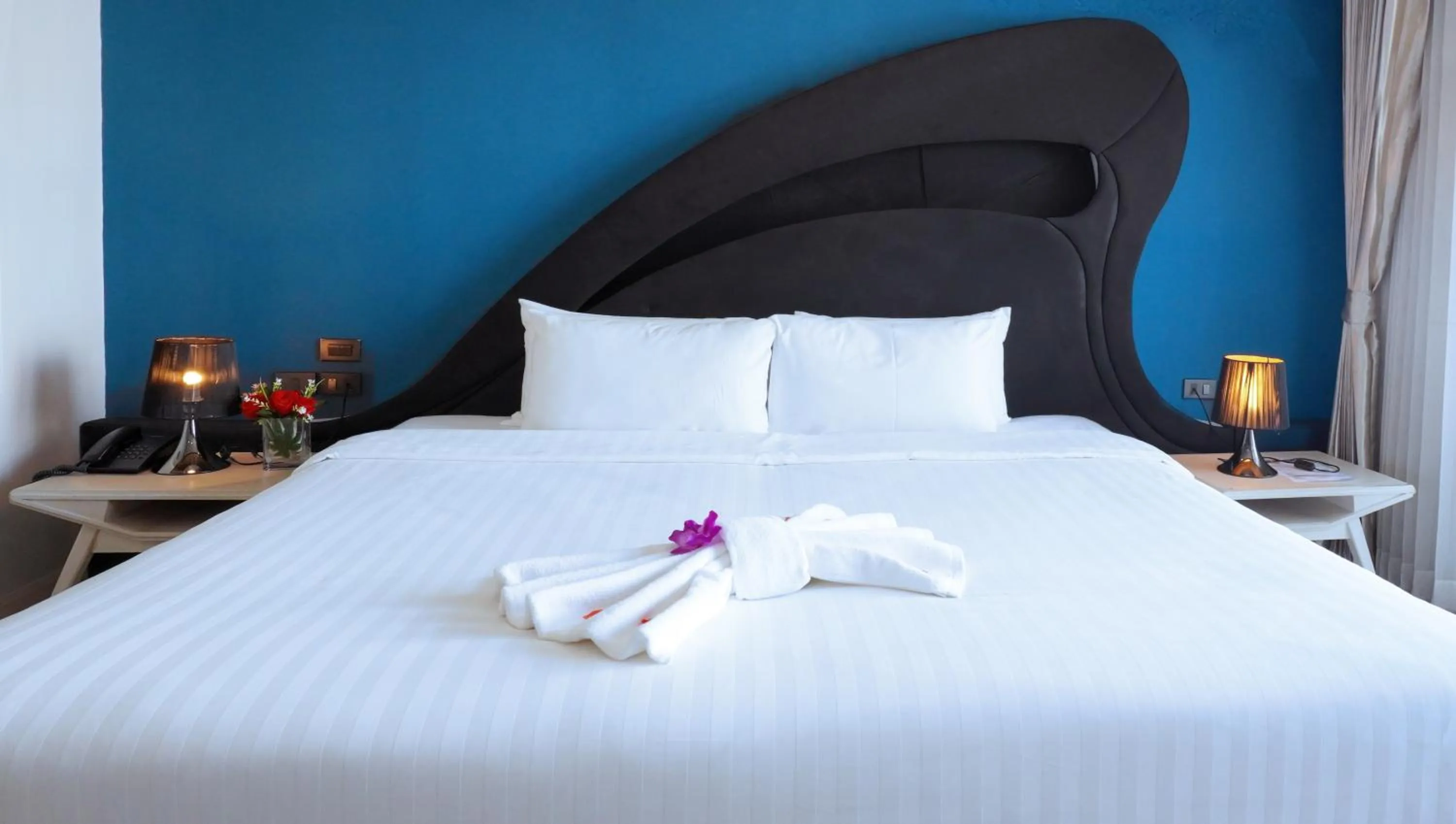 Bed in Blue Boat Hotel JC