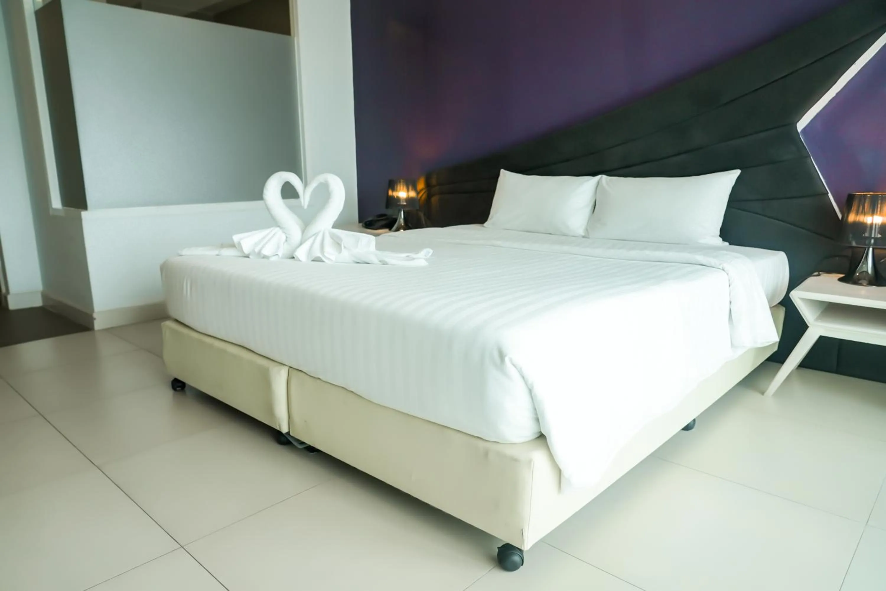 Bed in Blue Boat Hotel JC