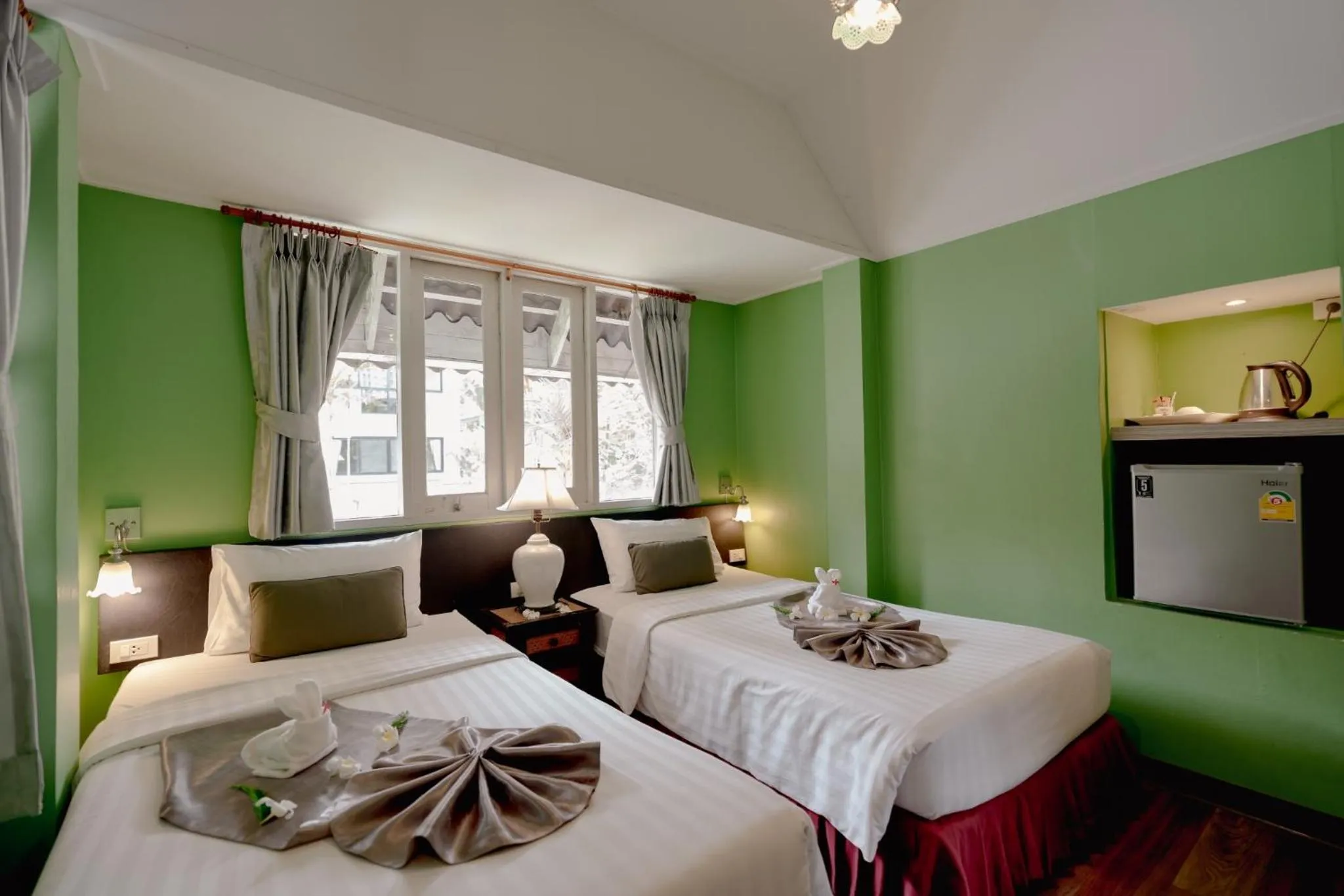 Bed in Natural Park Resort Pattaya