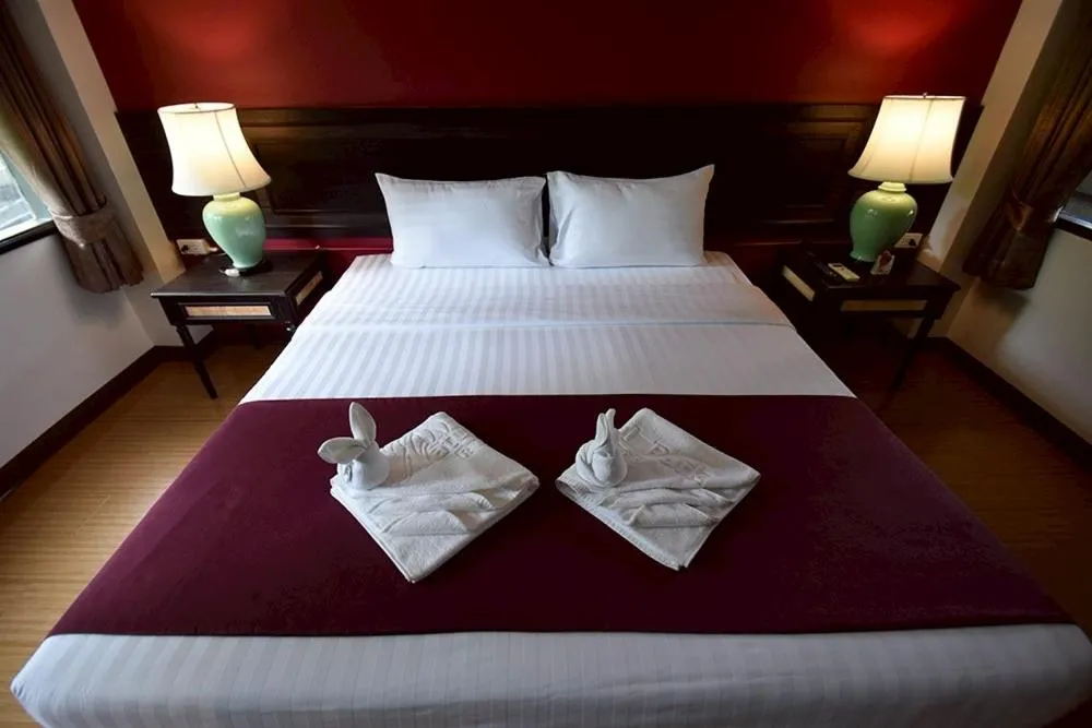 Bed in Natural Park Resort Pattaya