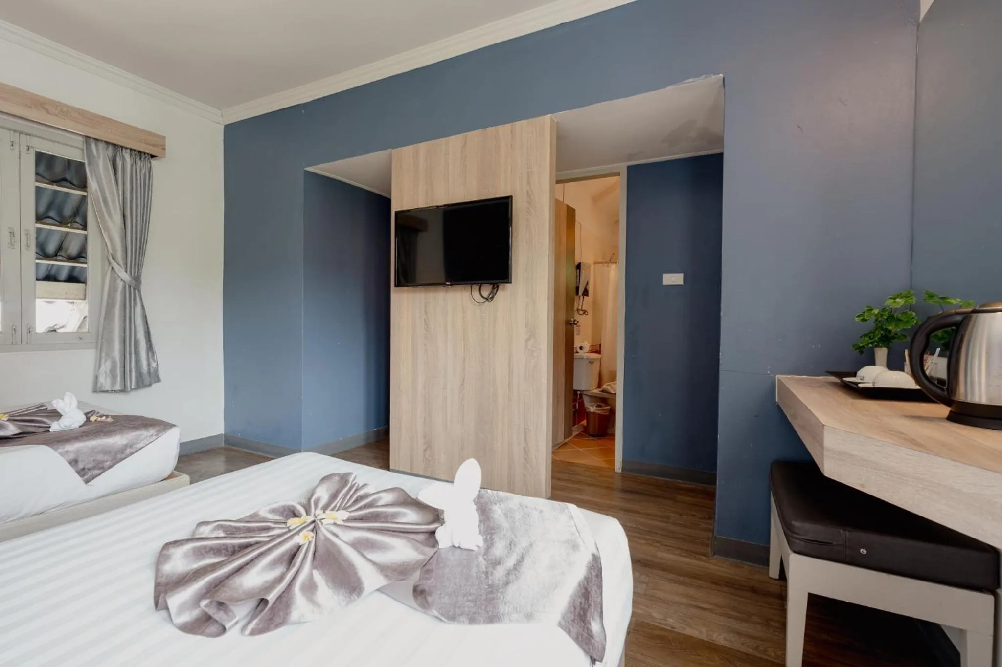 Bed in Natural Park Resort Pattaya