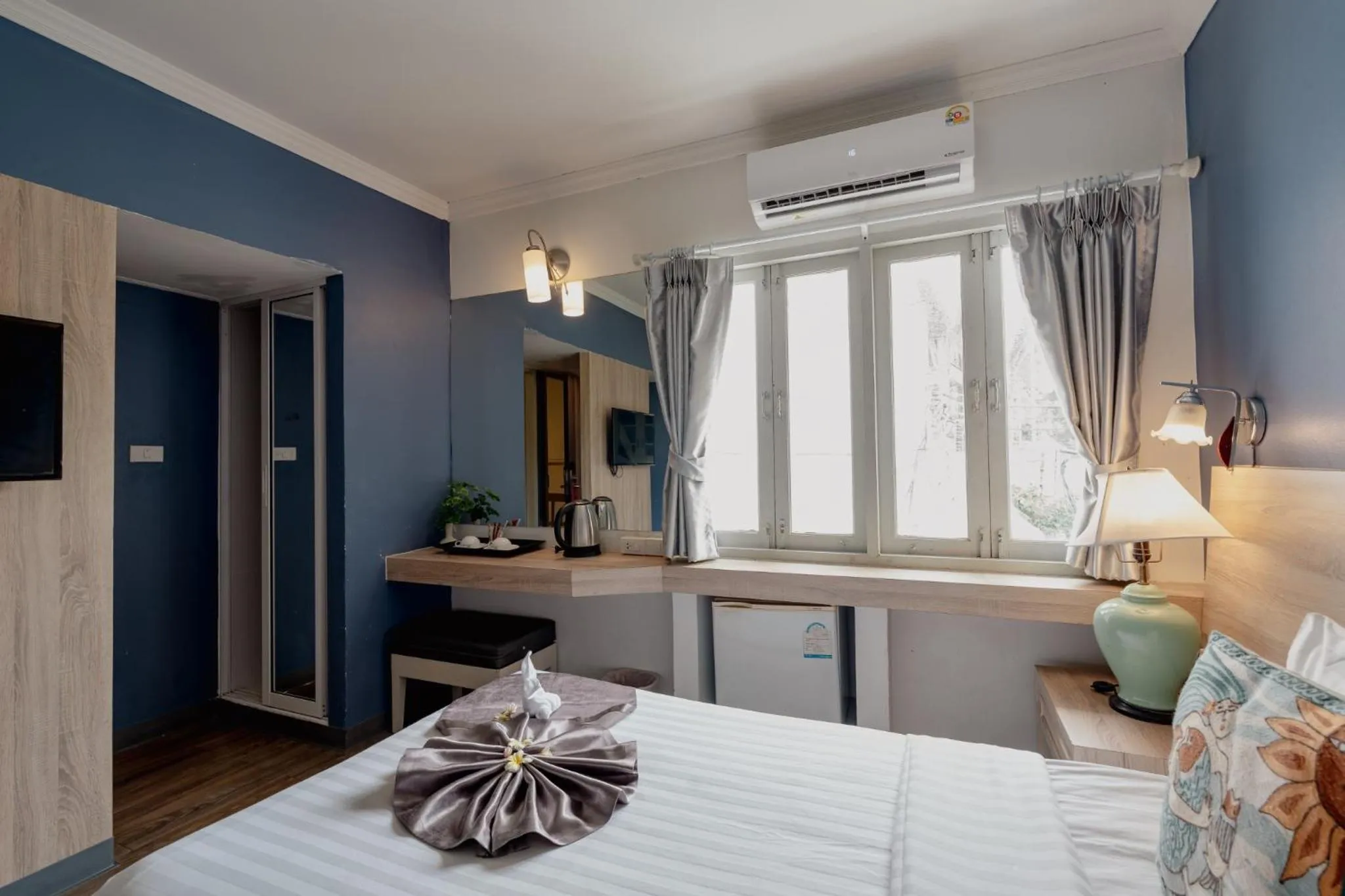 Bed in Natural Park Resort Pattaya