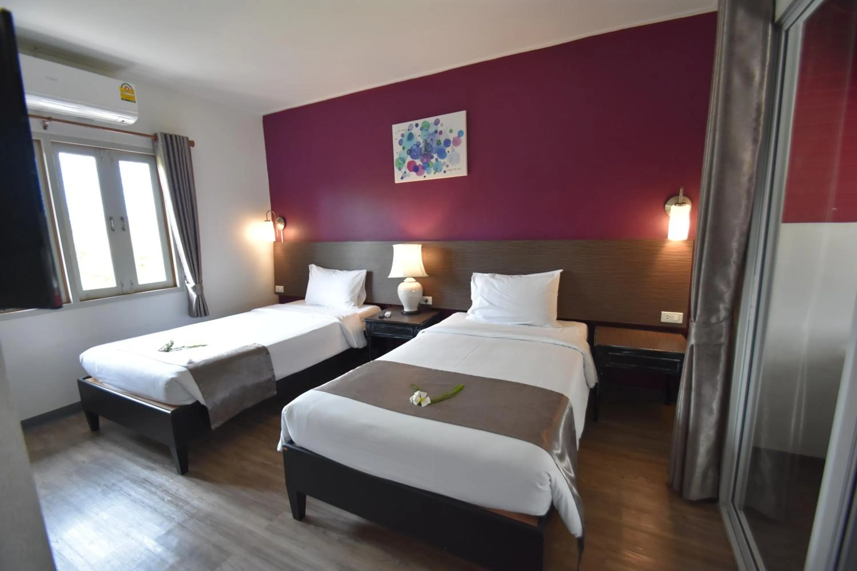 Bed in Natural Park Resort Pattaya