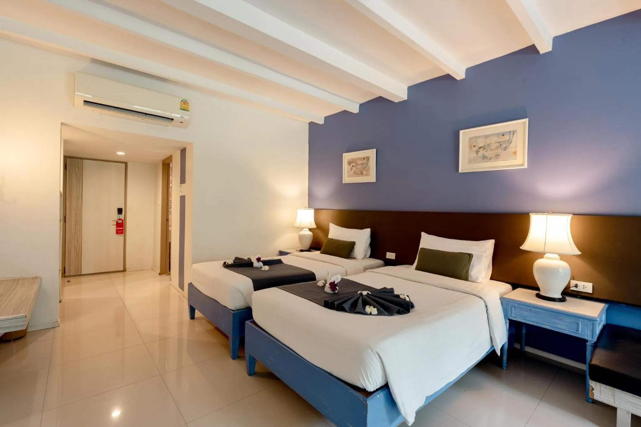 Bed in Natural Park Resort Pattaya