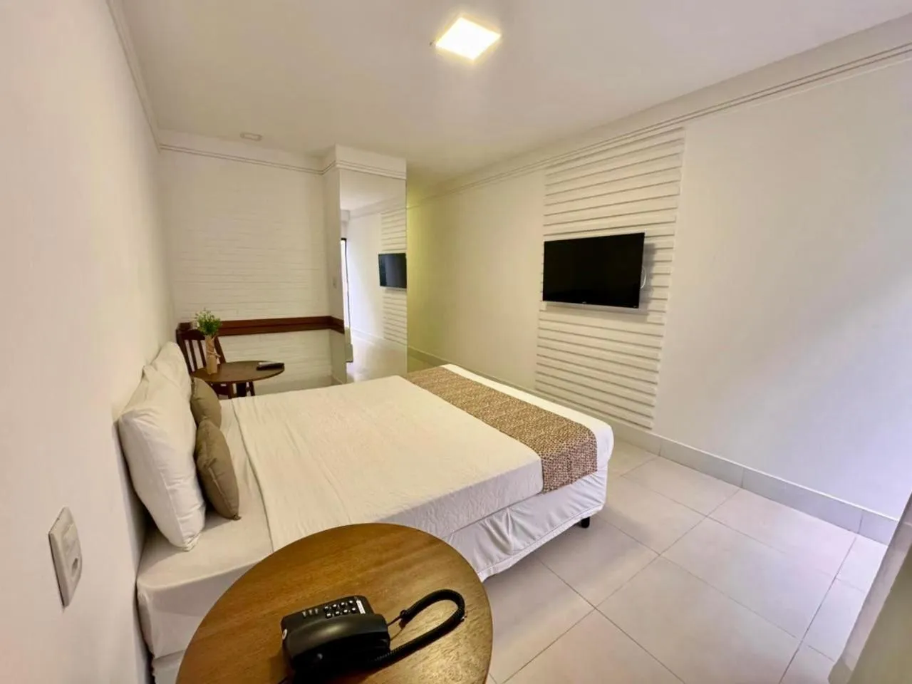 Bed in Recanto da Passagem Premium Hotel