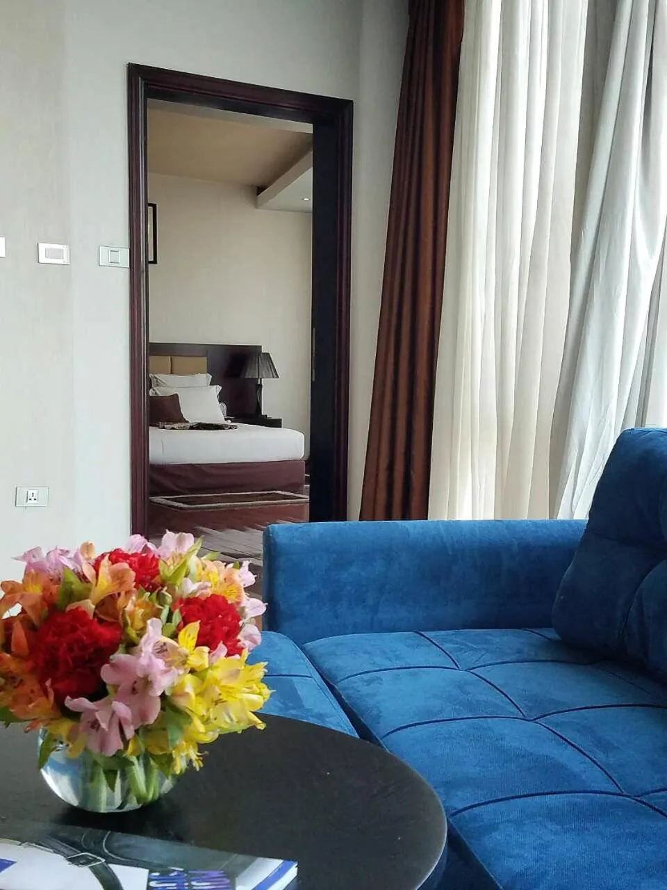 Living room, Bed in Grand Eliana Hotel Conference & Spa