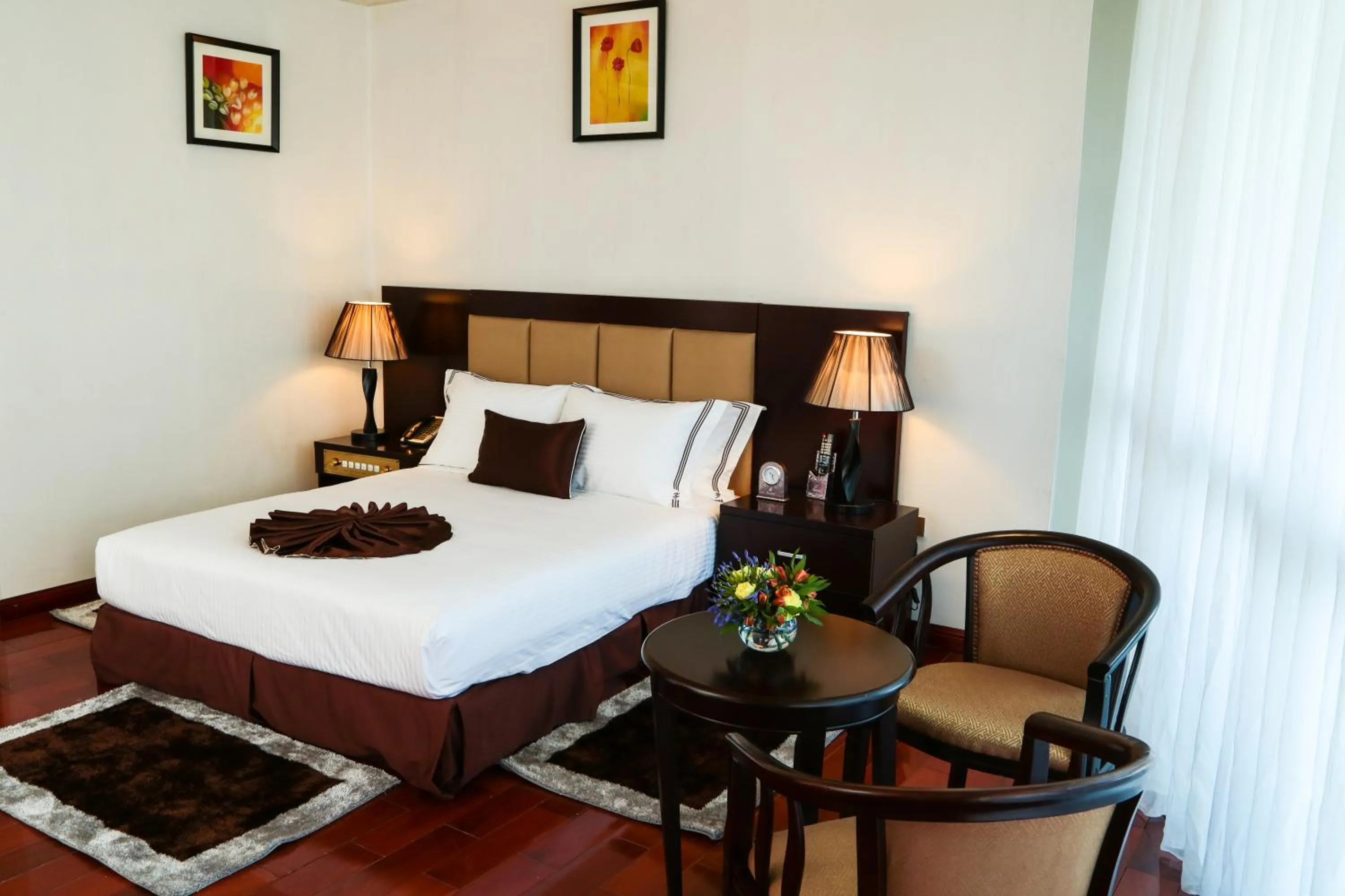 Living room, Bed in Grand Eliana Hotel Conference & Spa