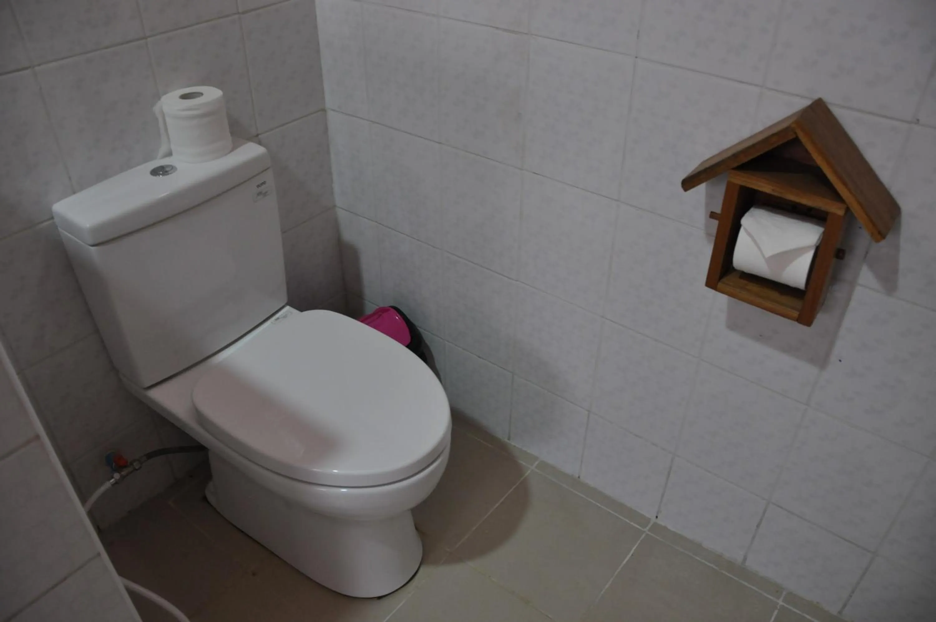 Toilet in Trinity Family Inn