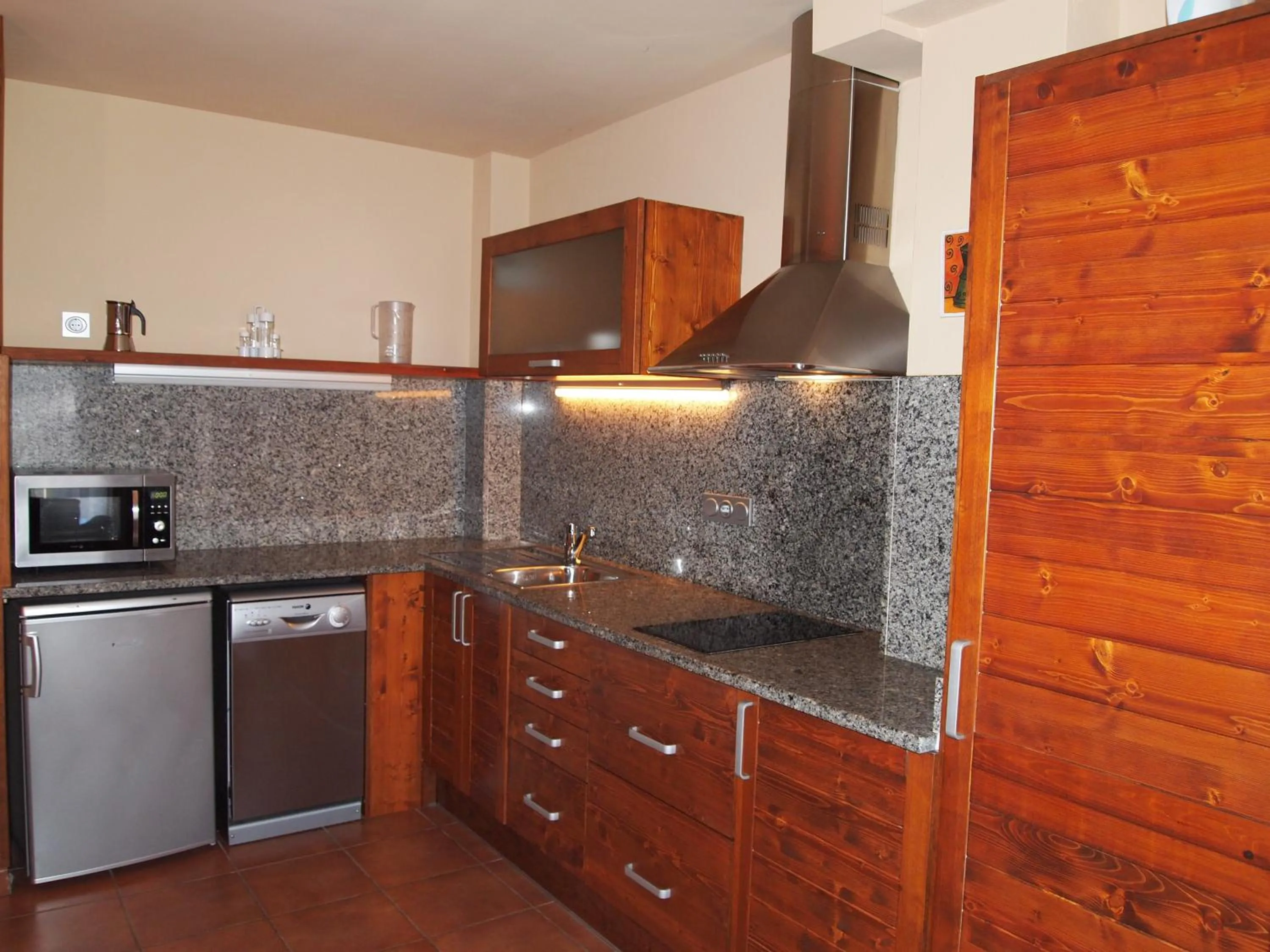 Kitchen or kitchenette in Aparthotel Bellver