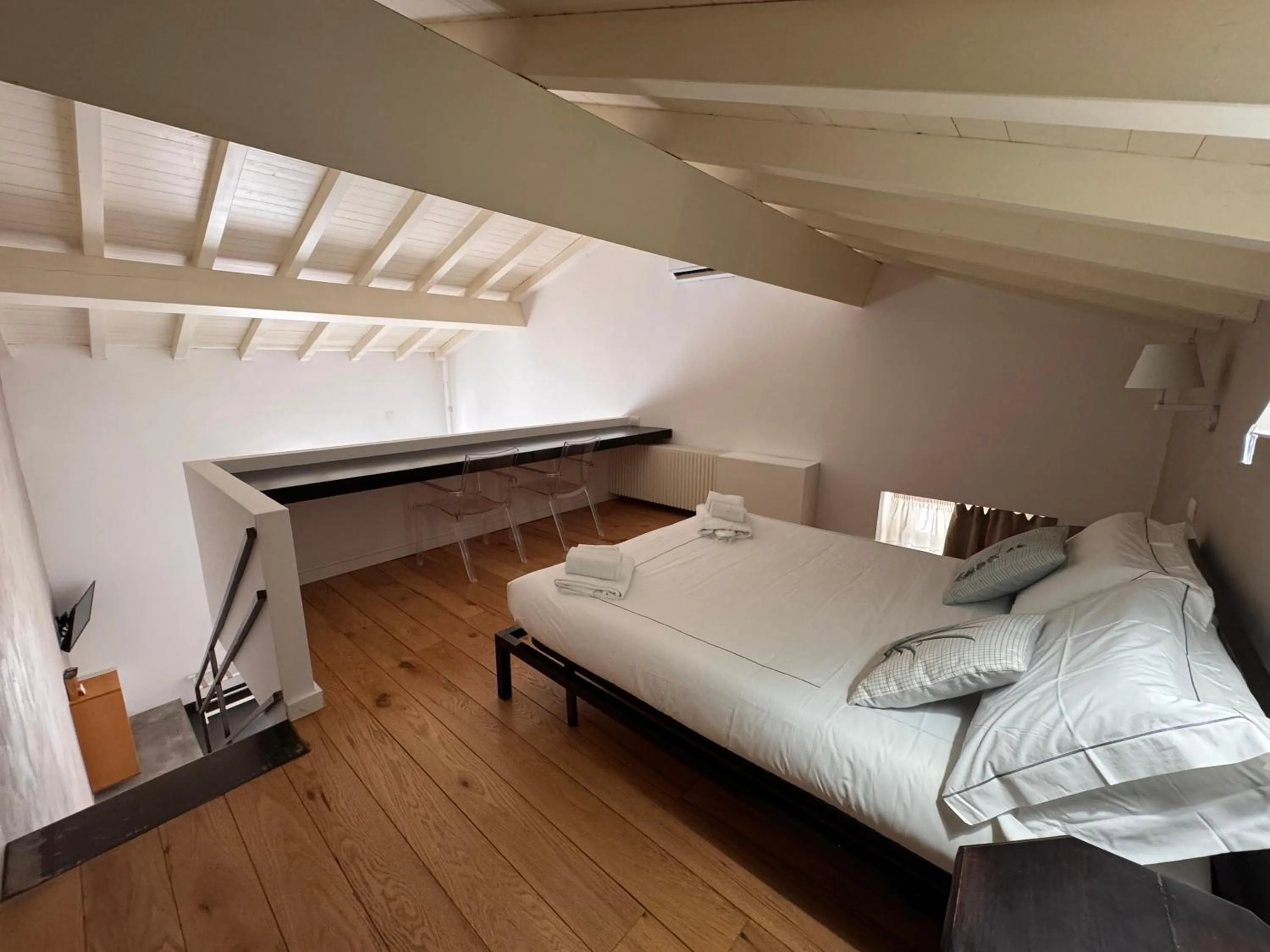 Bed in Talè Restaurant & Suite