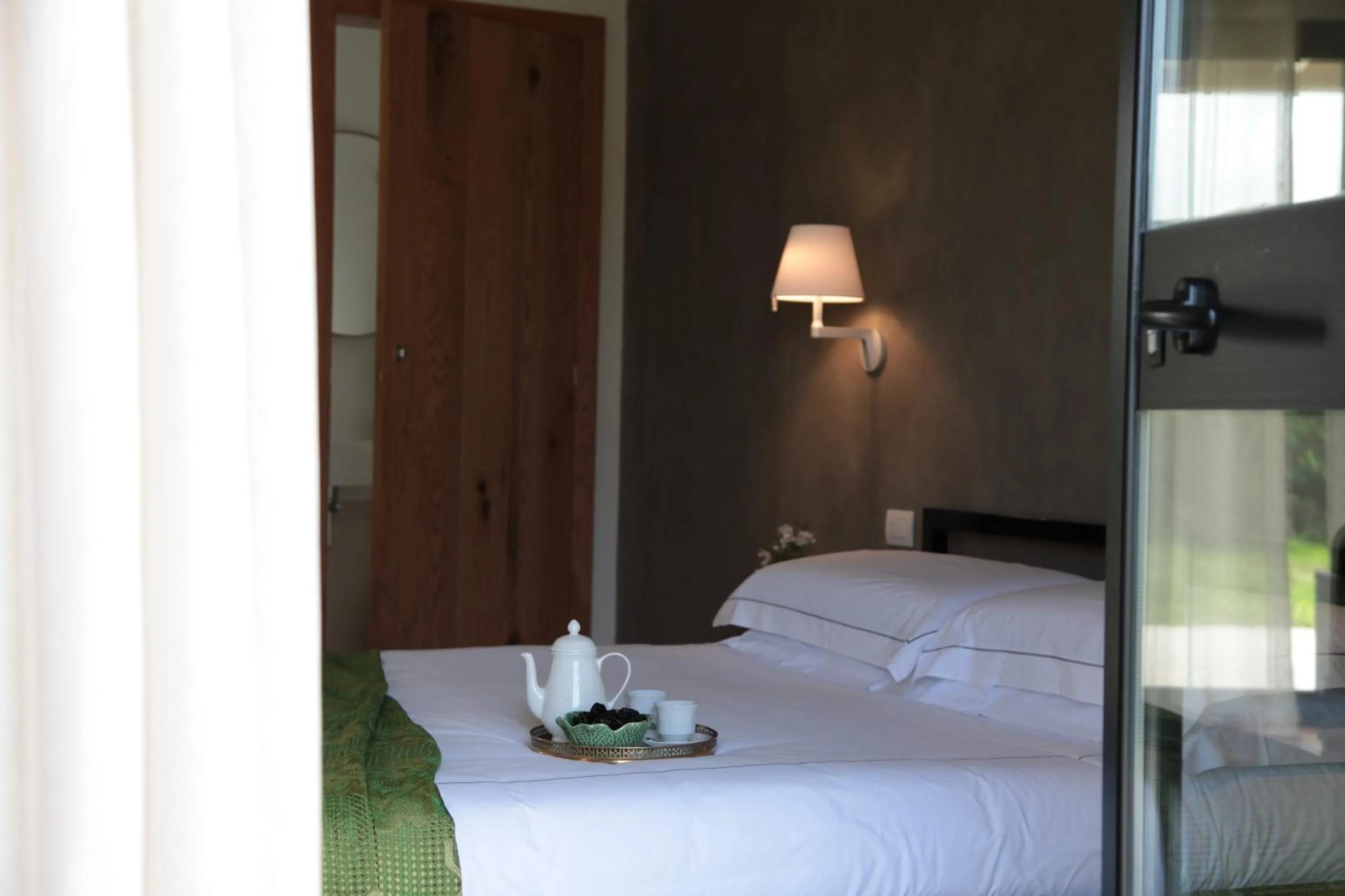 Bed in Talè Restaurant & Suite