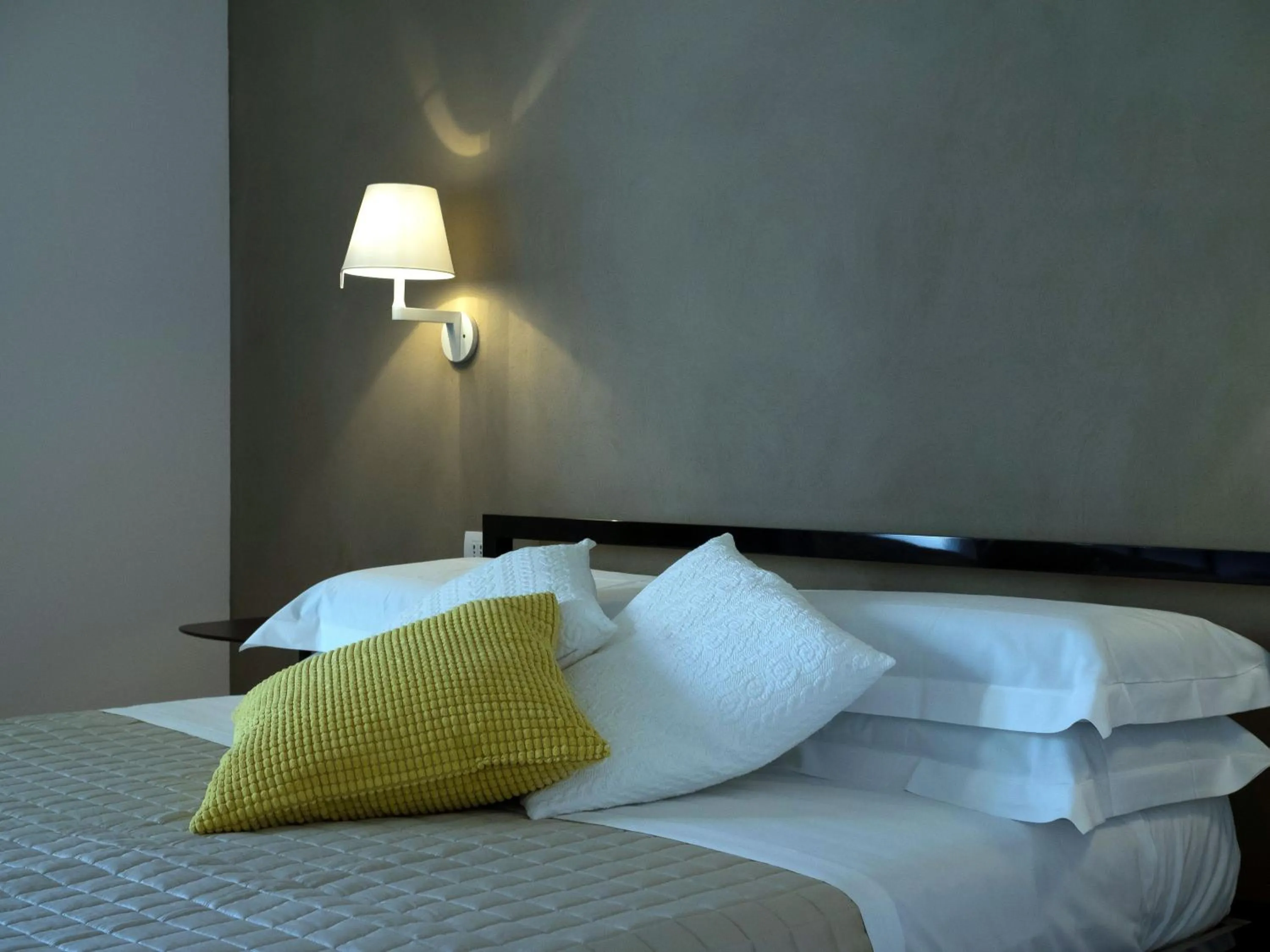 Bed in Talè Restaurant & Suite