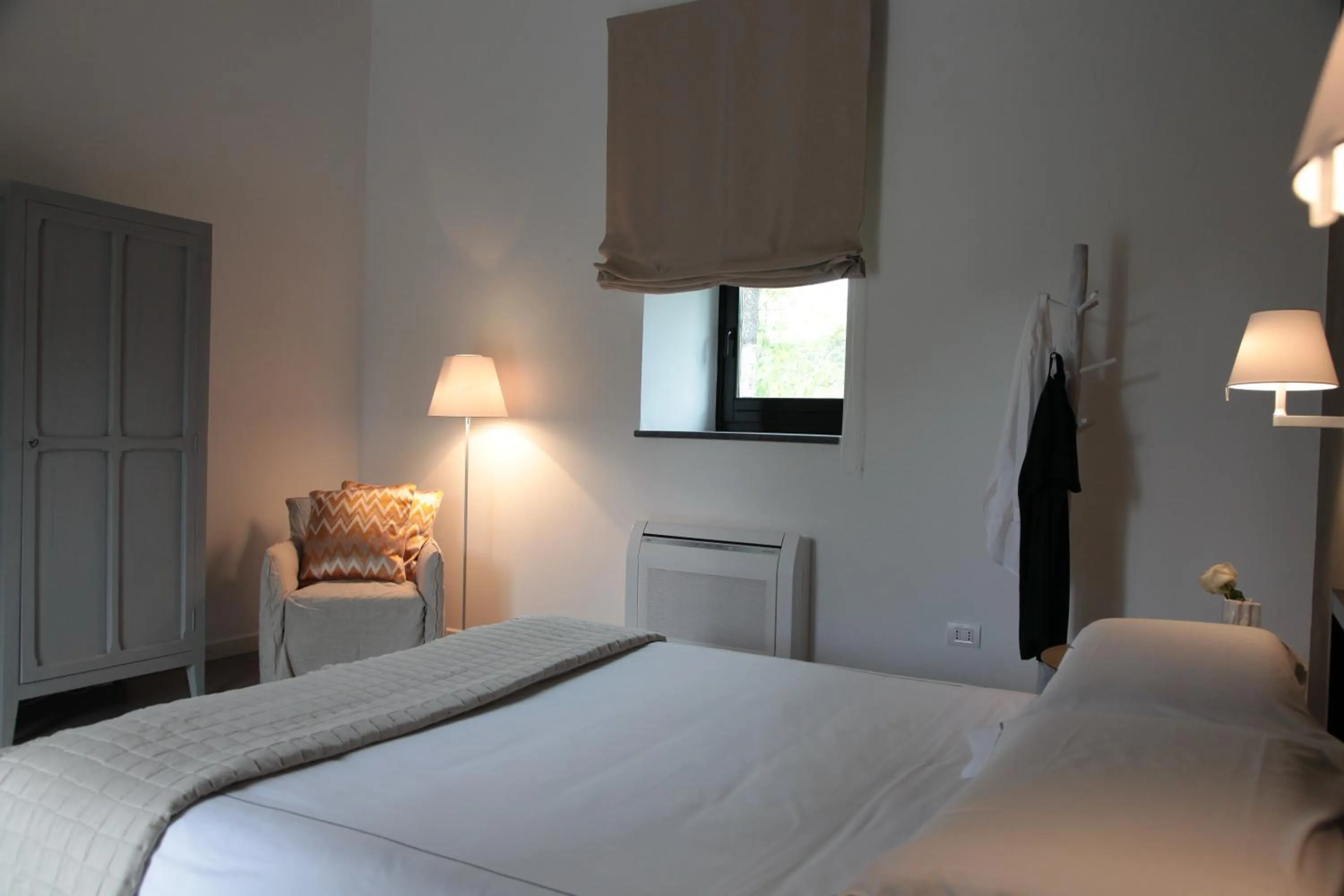 Bed in Talè Restaurant & Suite