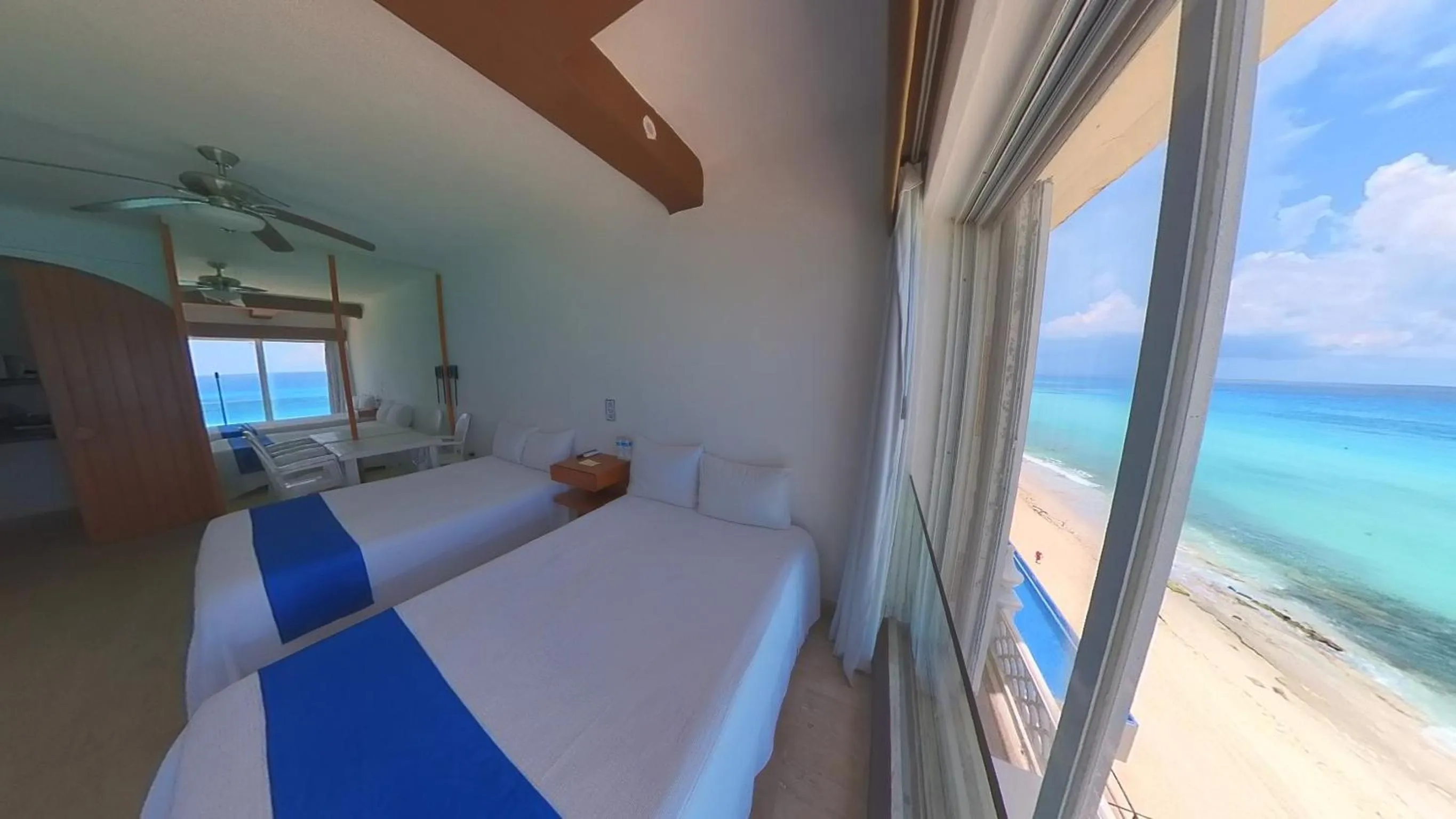 Bed in Cancún Plaza Sea View