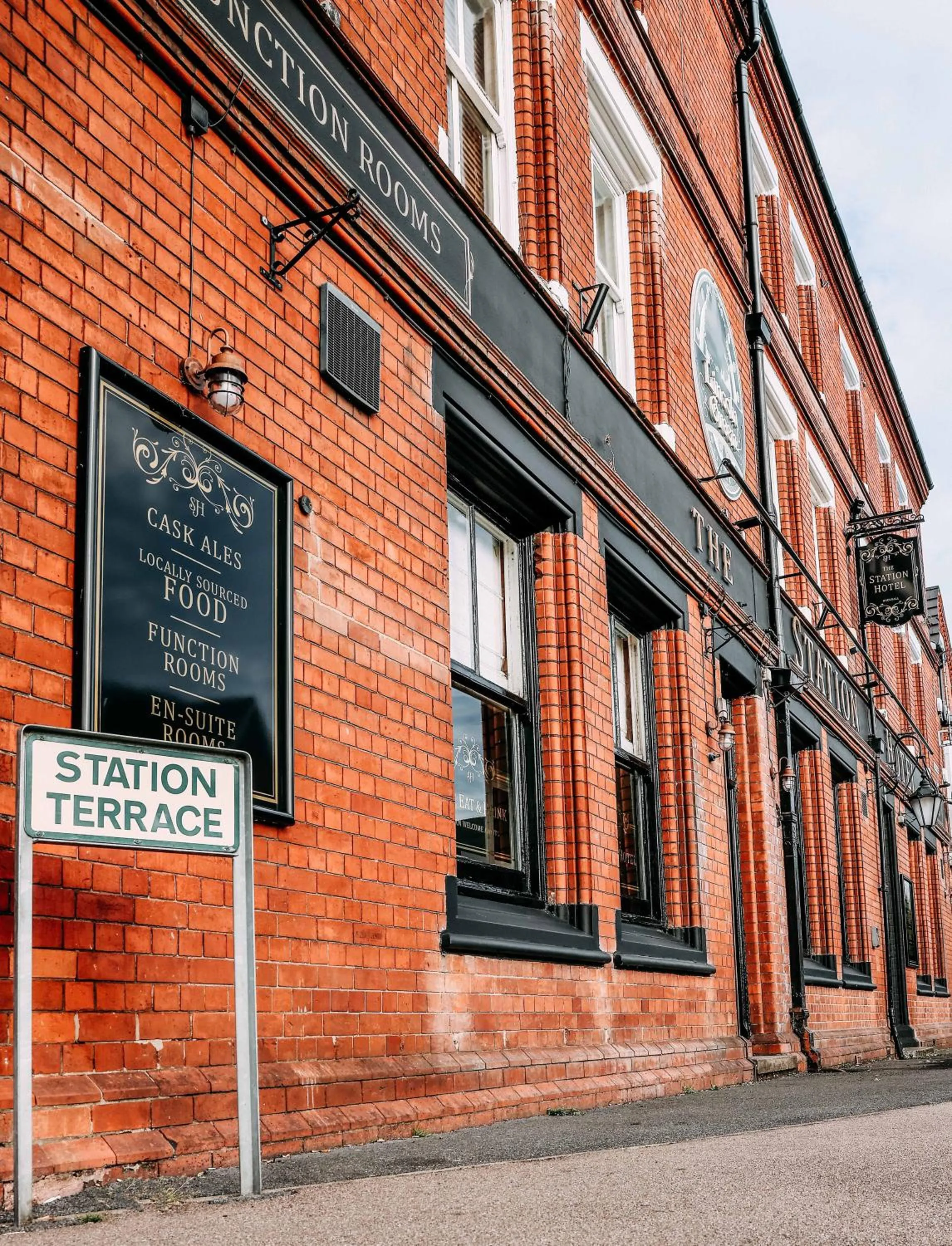 Property logo or sign in Station Hotel