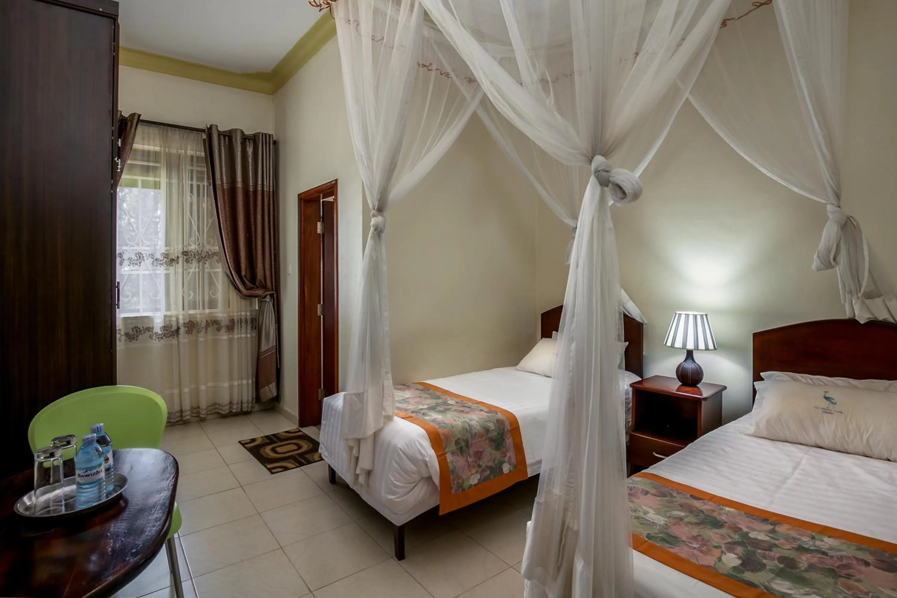 View (from property/room), Bed in The Crested Crane Bwindi Hotel