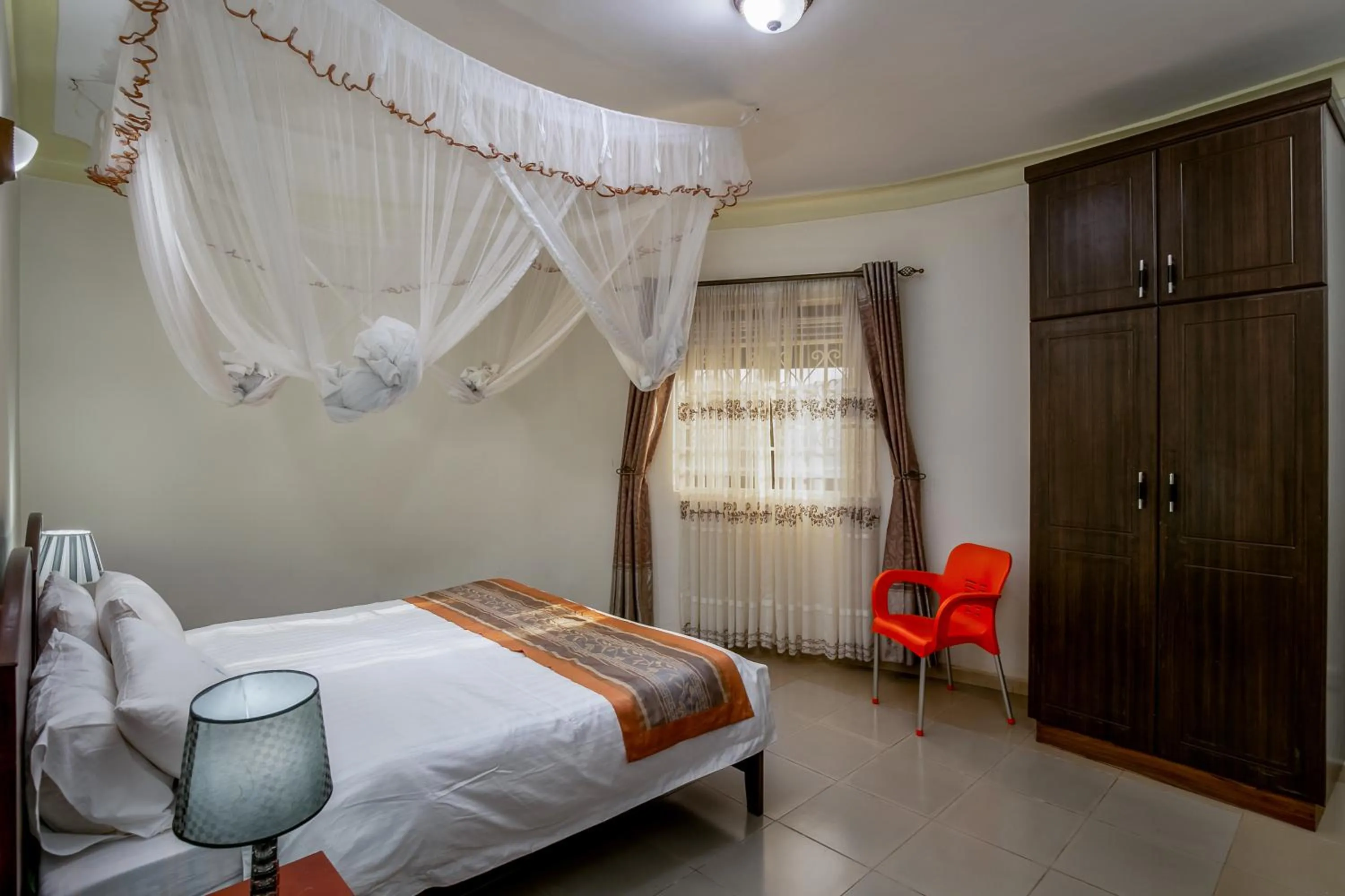 Bedroom, Bed in The Crested Crane Bwindi Hotel