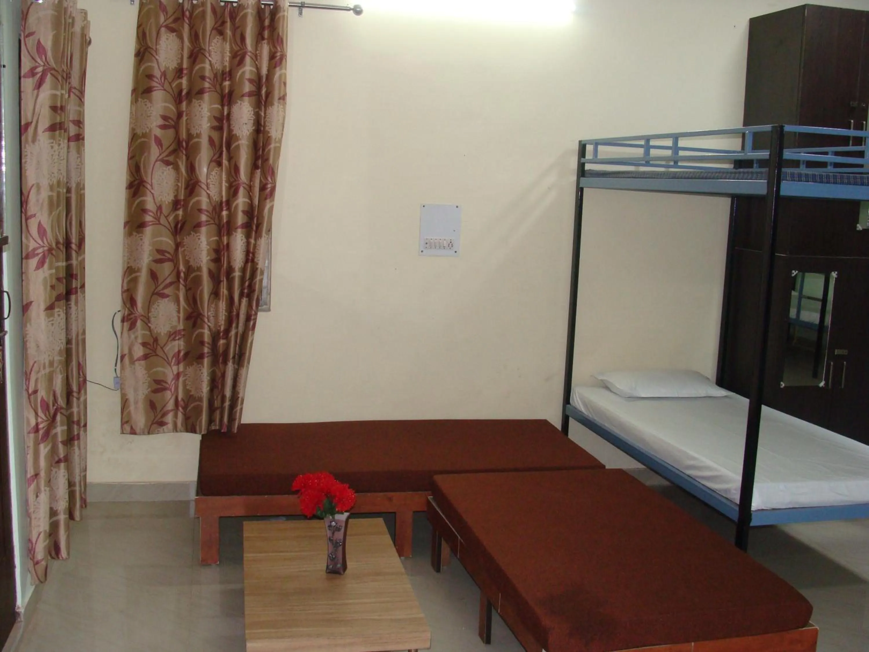 Seating area, Bed in Hotel Abhinandan Grand