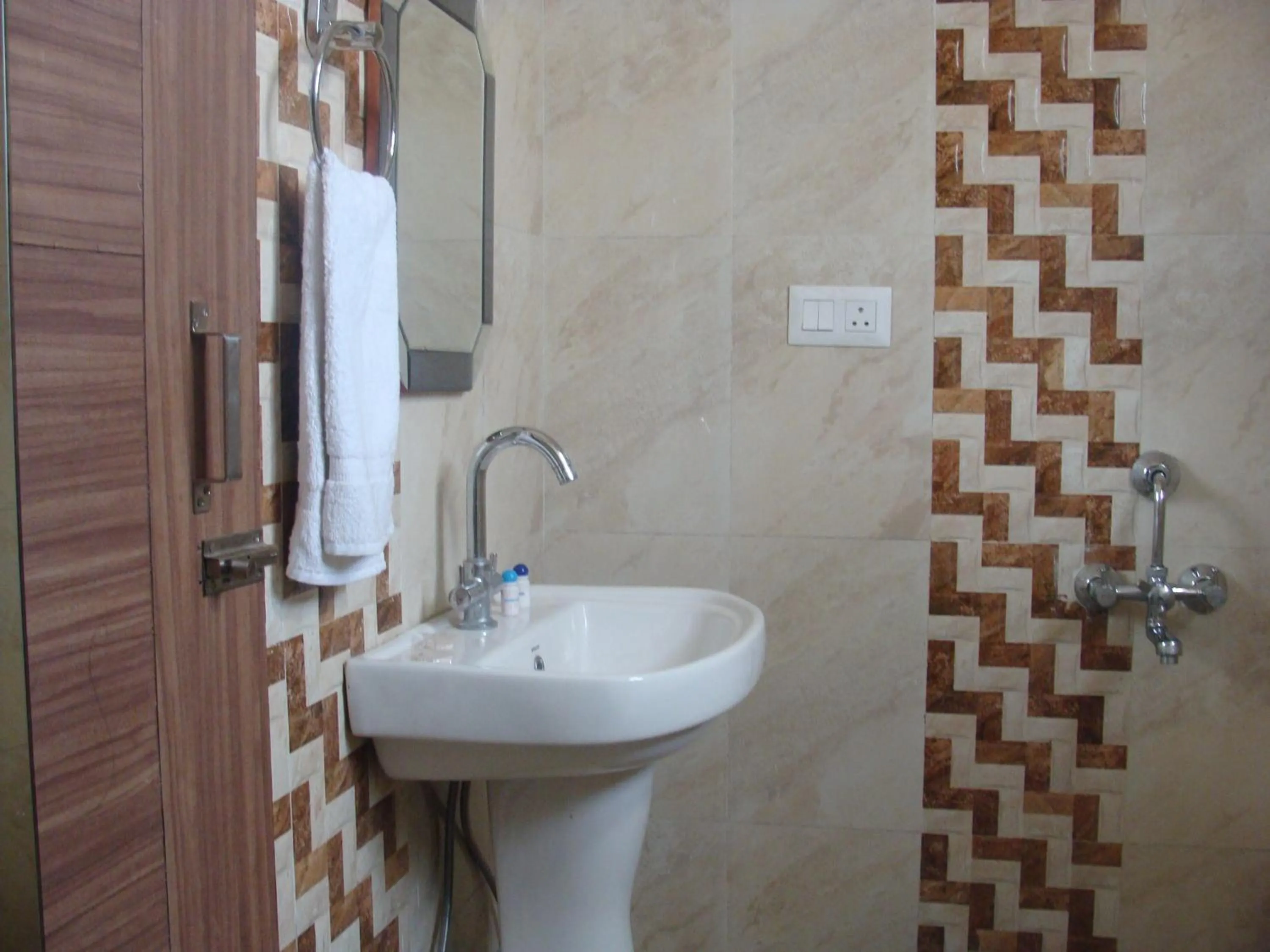 Bathroom in Hotel Abhinandan Grand
