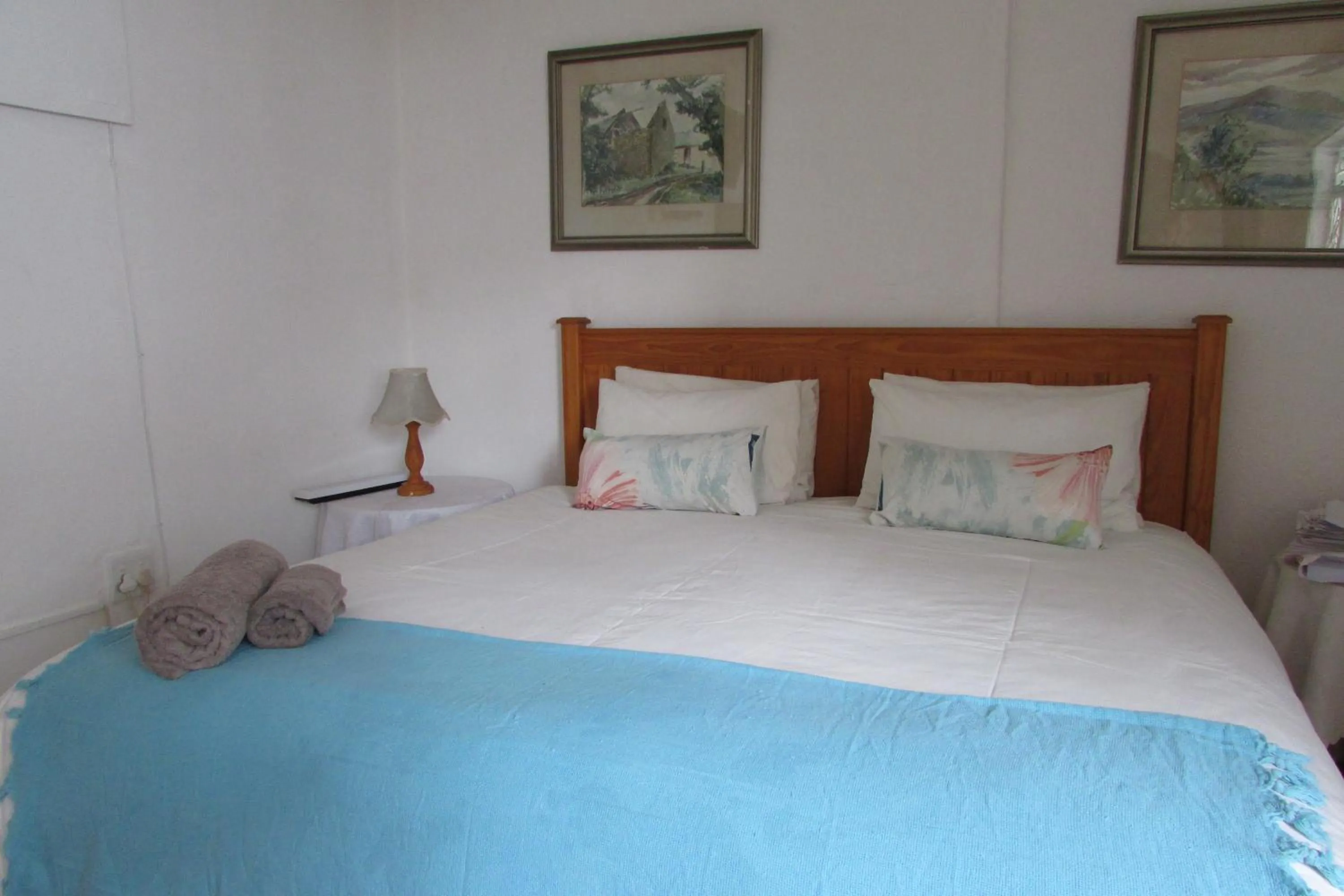 Bed in Absolute Leisure Cottages