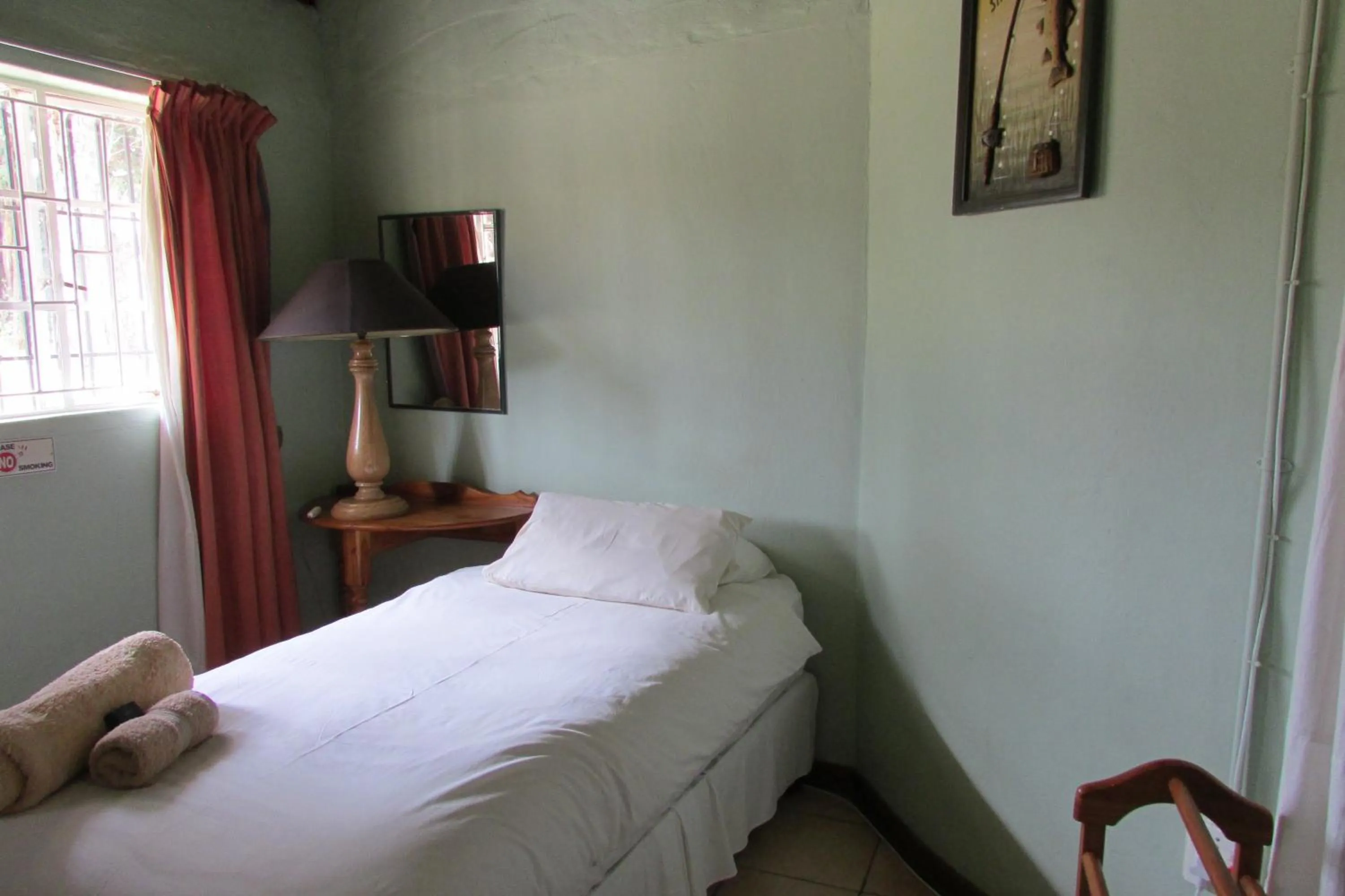 Bed in Absolute Leisure Cottages