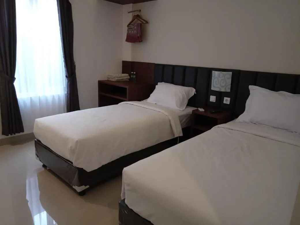 Bed in Alzara Hotel Syariah