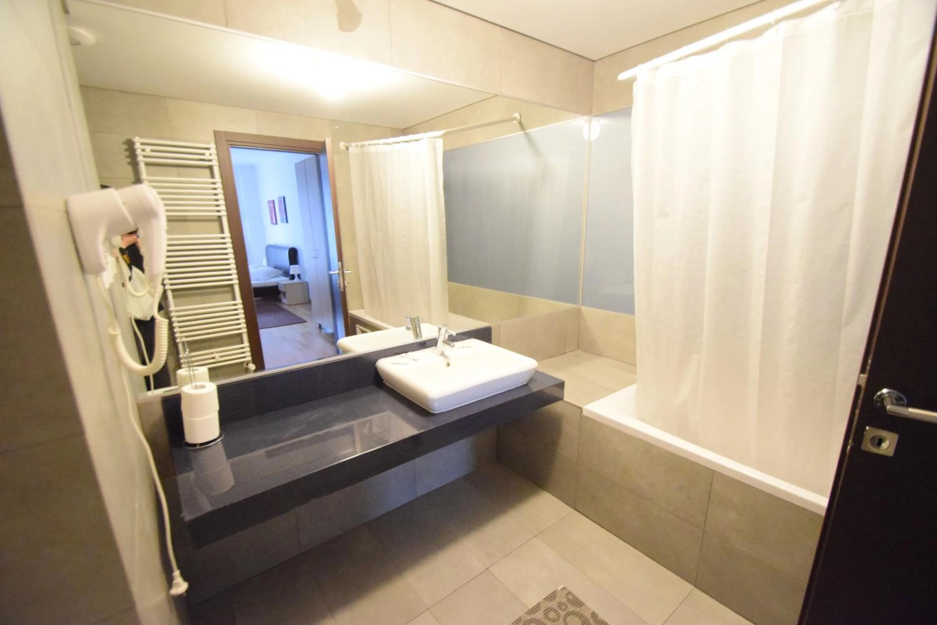 Bathroom, Bed in Upground Residence Apartments