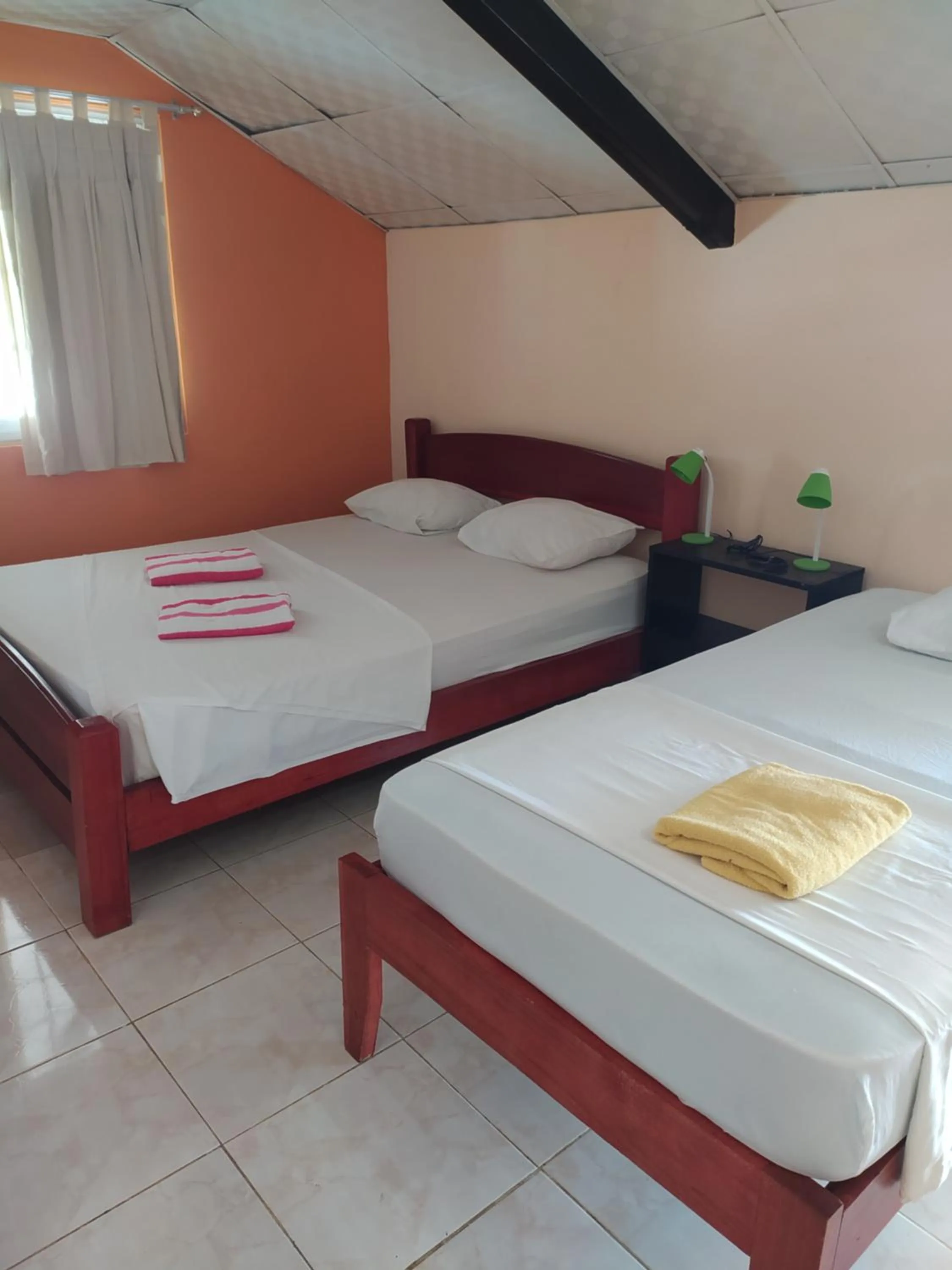 Bed in Sun Havens Apartments & Suites