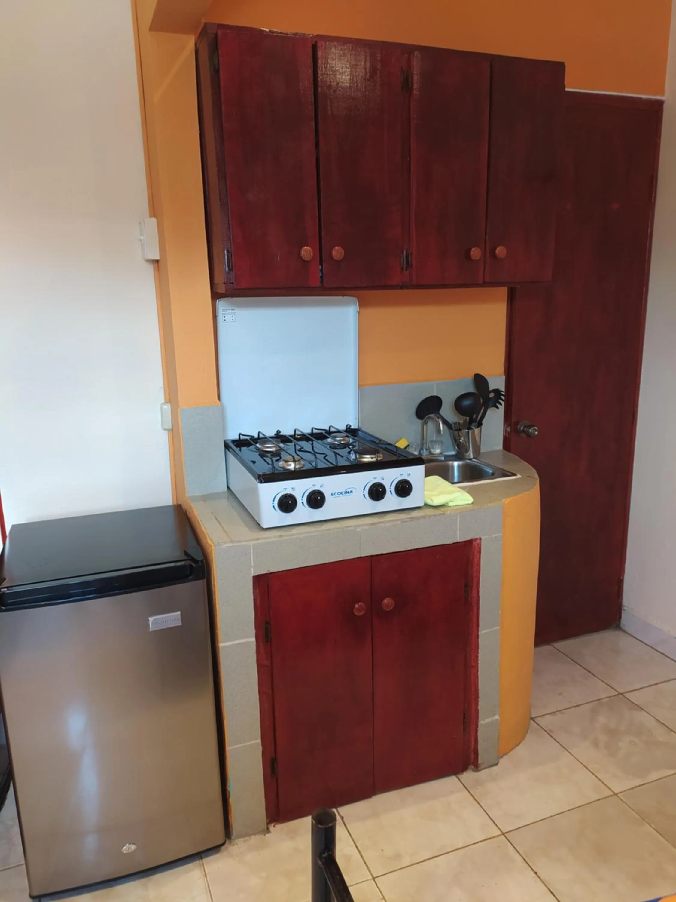 Kitchen or kitchenette in Sun Havens Apartments & Suites