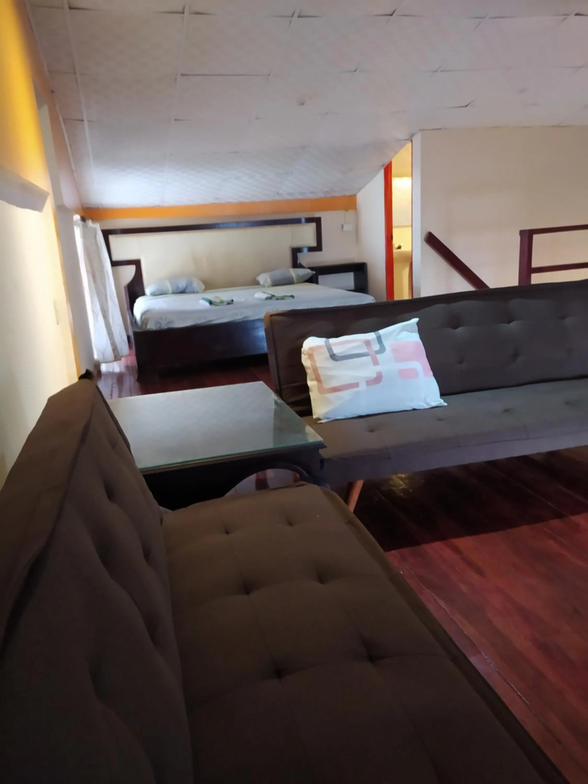 Bed in Sun Havens Apartments & Suites